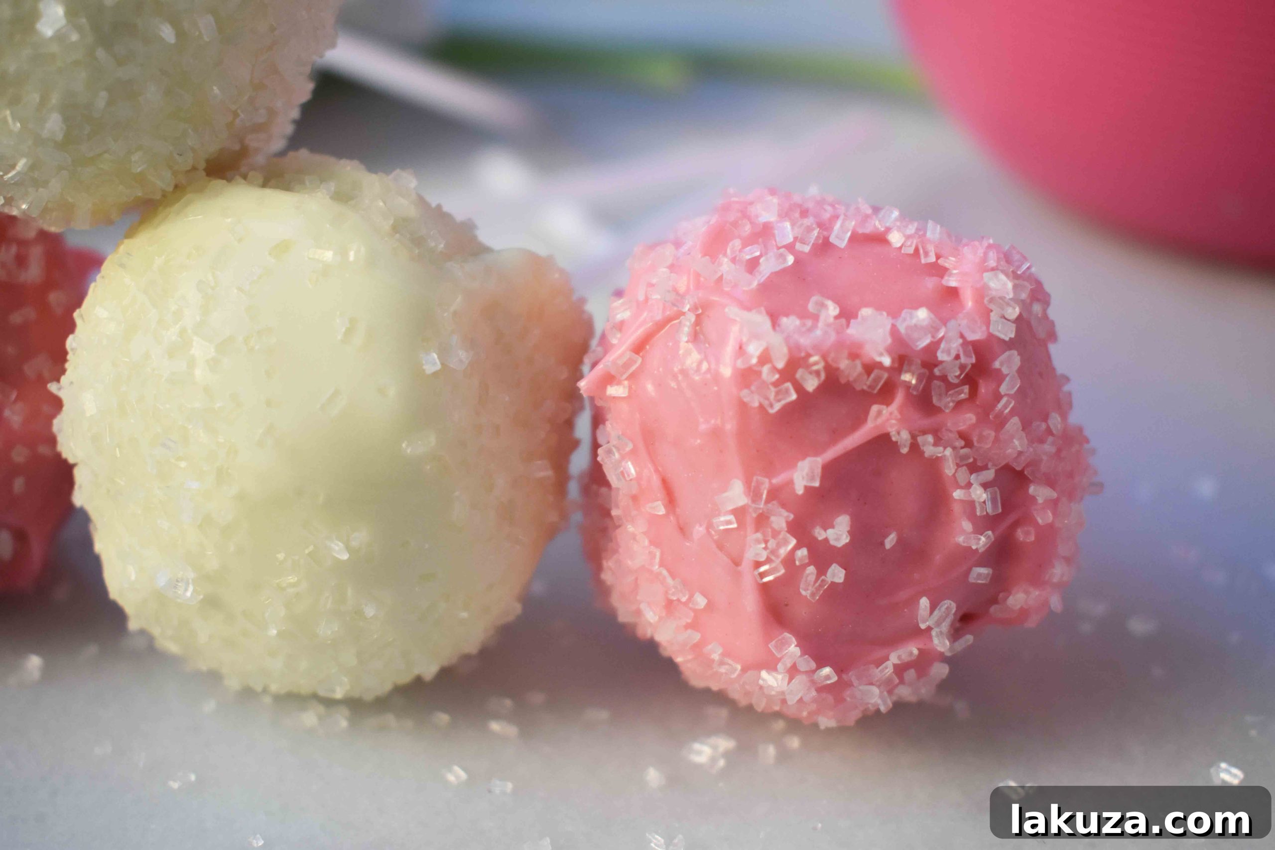 Strawberry Cheesecake Truffles 3 Strawberry Cheesecake Truffle Balls Cake Pops. Homemade yellow butter cake mixed with fresh strawberry cream cheese frosting. Then rolled in melted white melting wafers and sprinkled with sparkling sugar. www.modernhoney.com