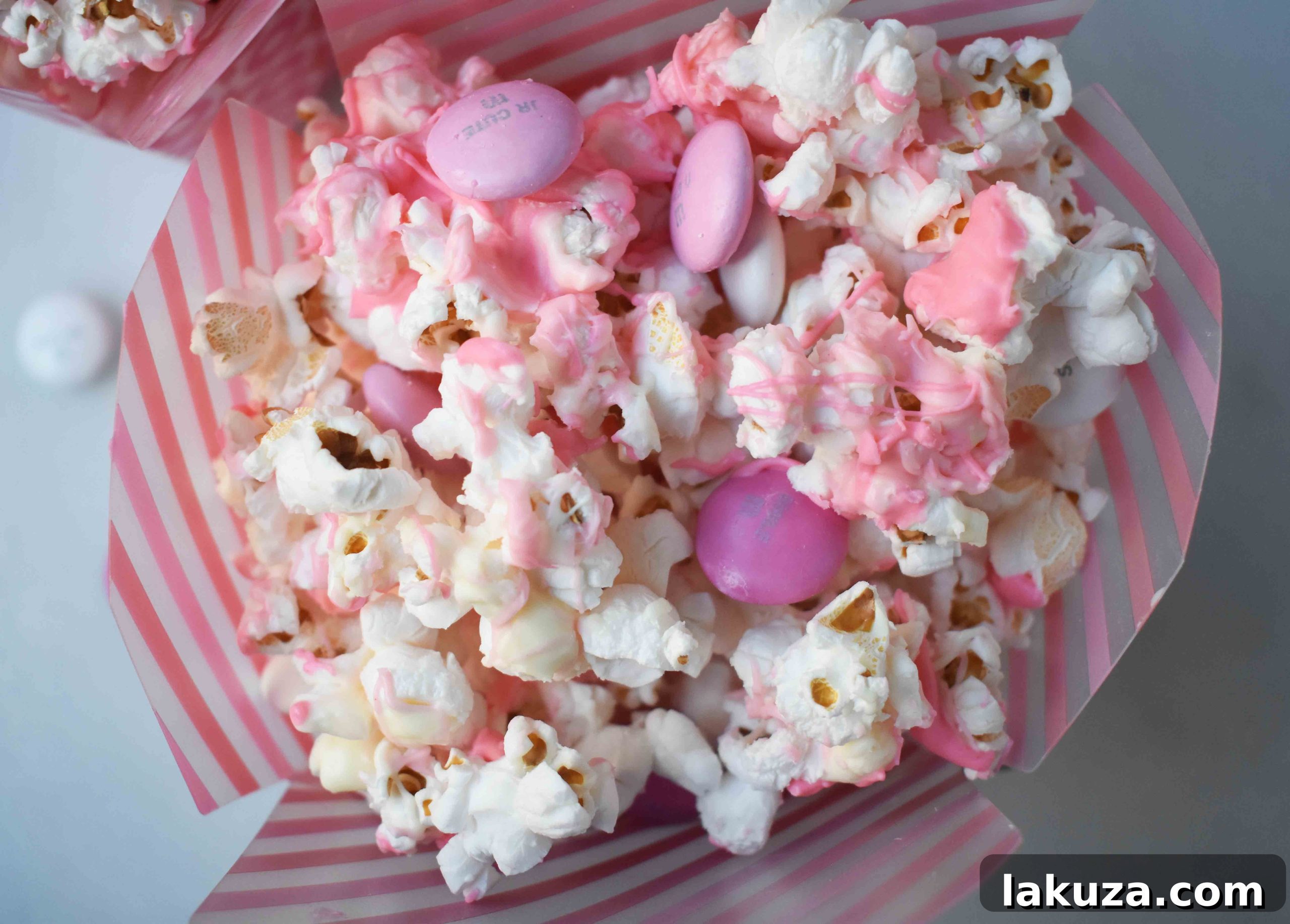 Irresistible Valentine White Chocolate M&M Popcorn 5 Finished Valentine's Day White Chocolate and M & M Popcorn, ready to be enjoyed or shared as a festive treat.