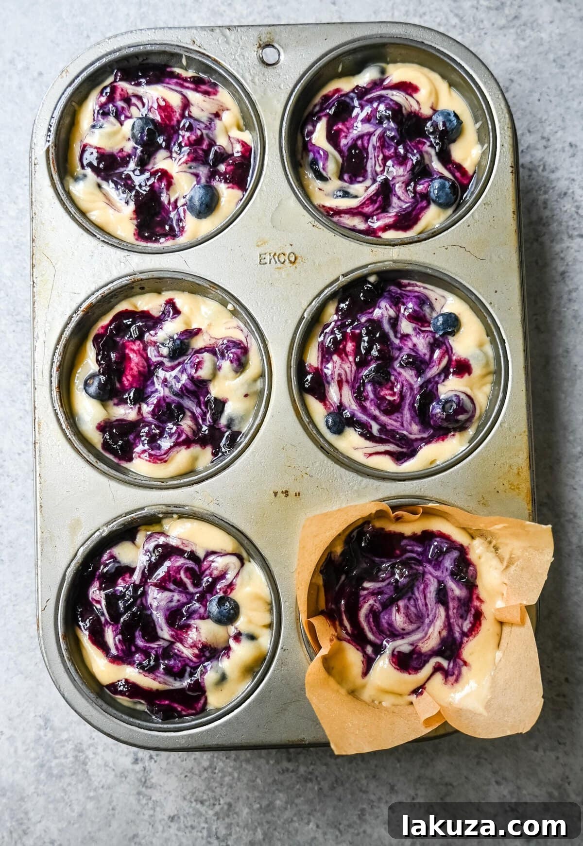 Fluffy blueberry muffins with a sparkling sugar topping, ready to be enjoyed.