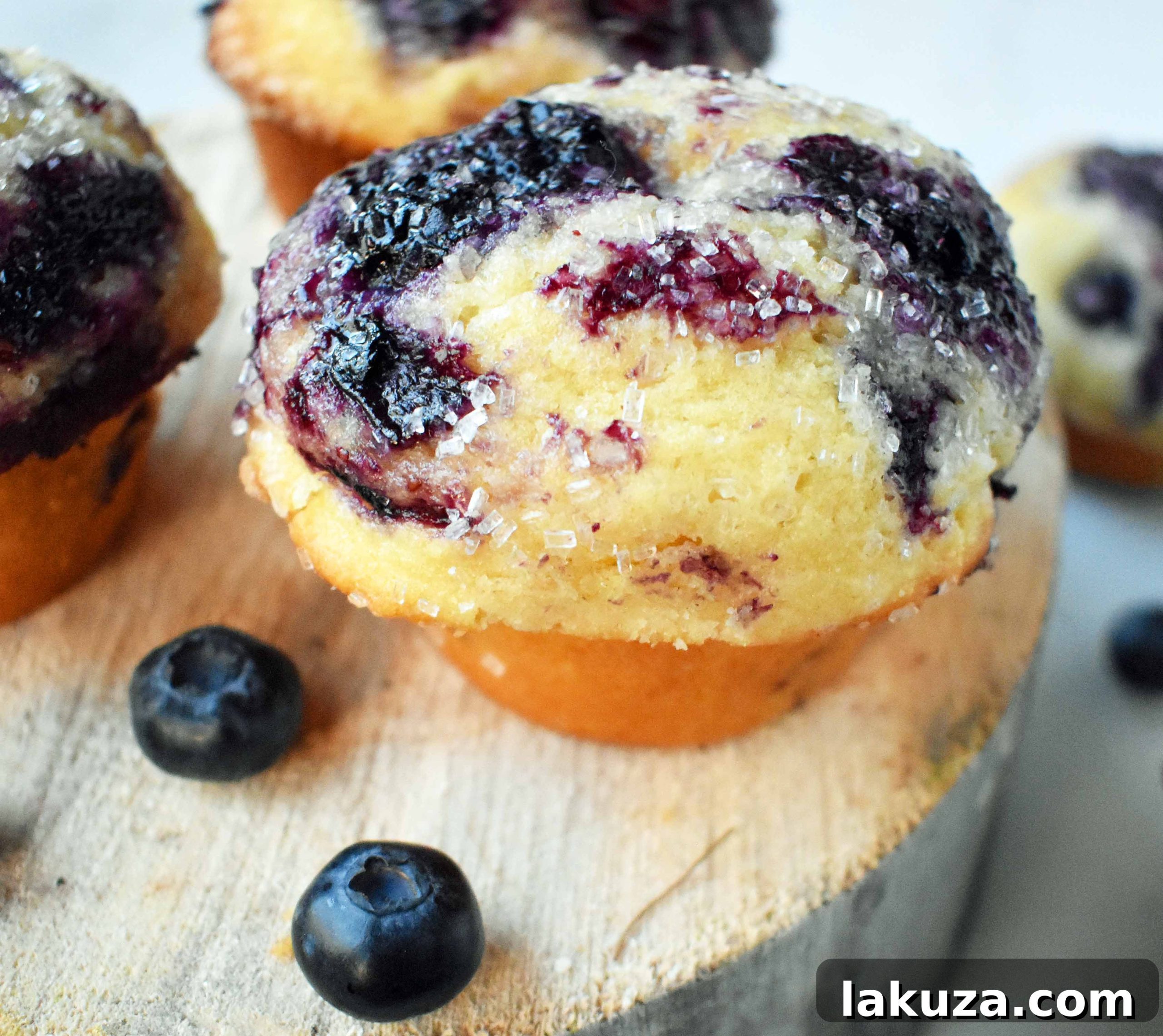 A basket full of golden-brown blueberry muffins, perfectly risen and ready to serve.