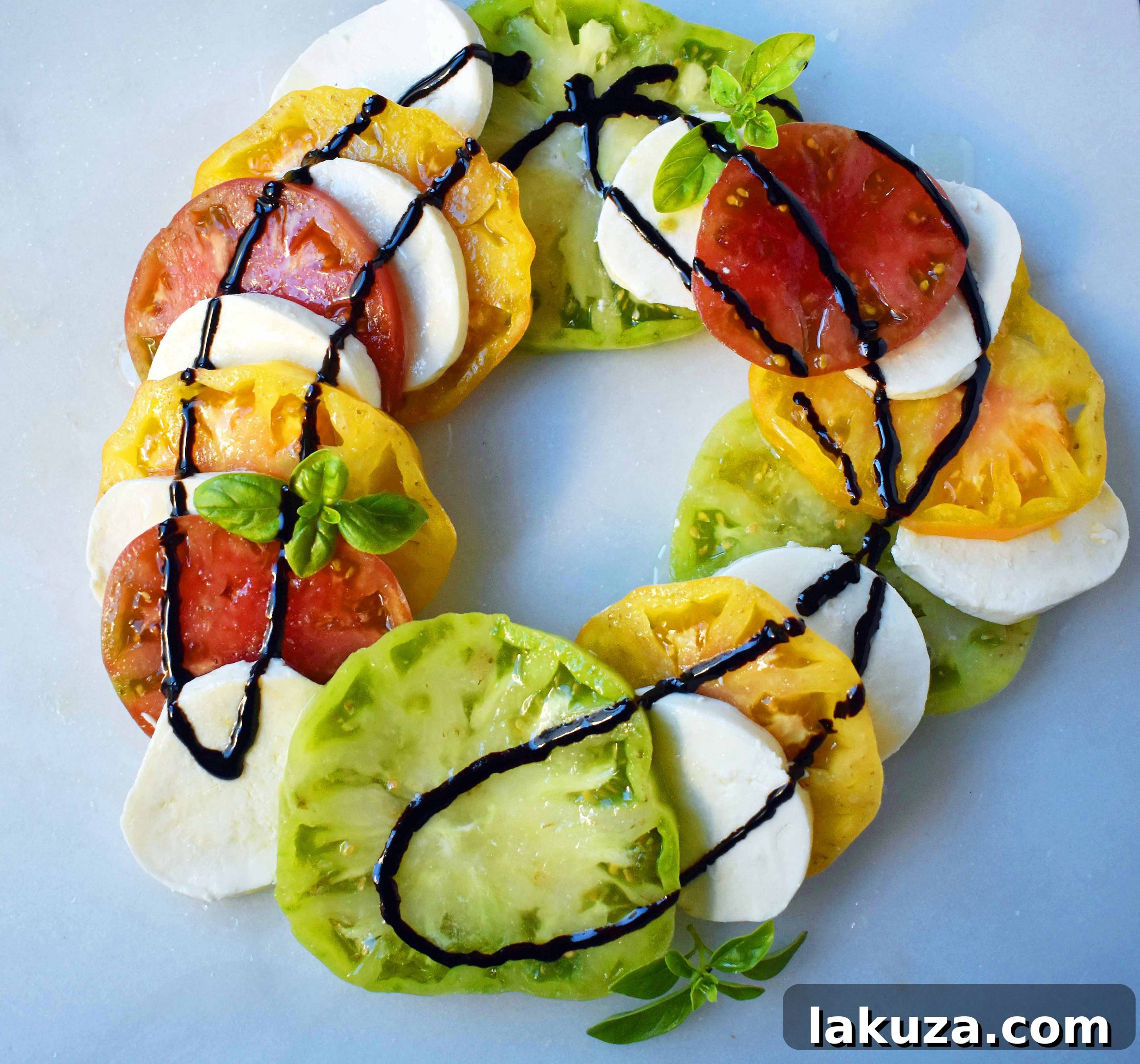 Radiant Heirloom Caprese 2 Vibrant Heirloom Tomato Caprese Salad with fresh mozzarella, basil, olive oil, and balsamic glaze.