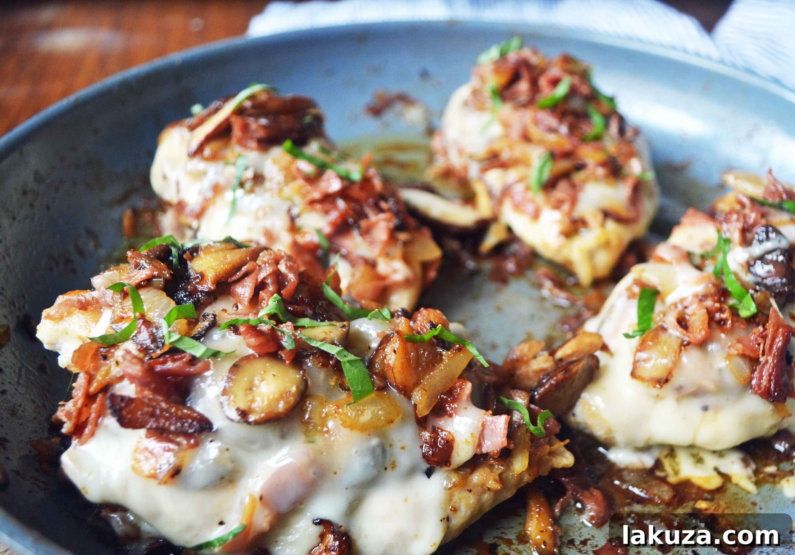Delicious Chicken Rosa Maria featuring seared chicken breast, sautéed onions, garlic, mushrooms, and melted fontina