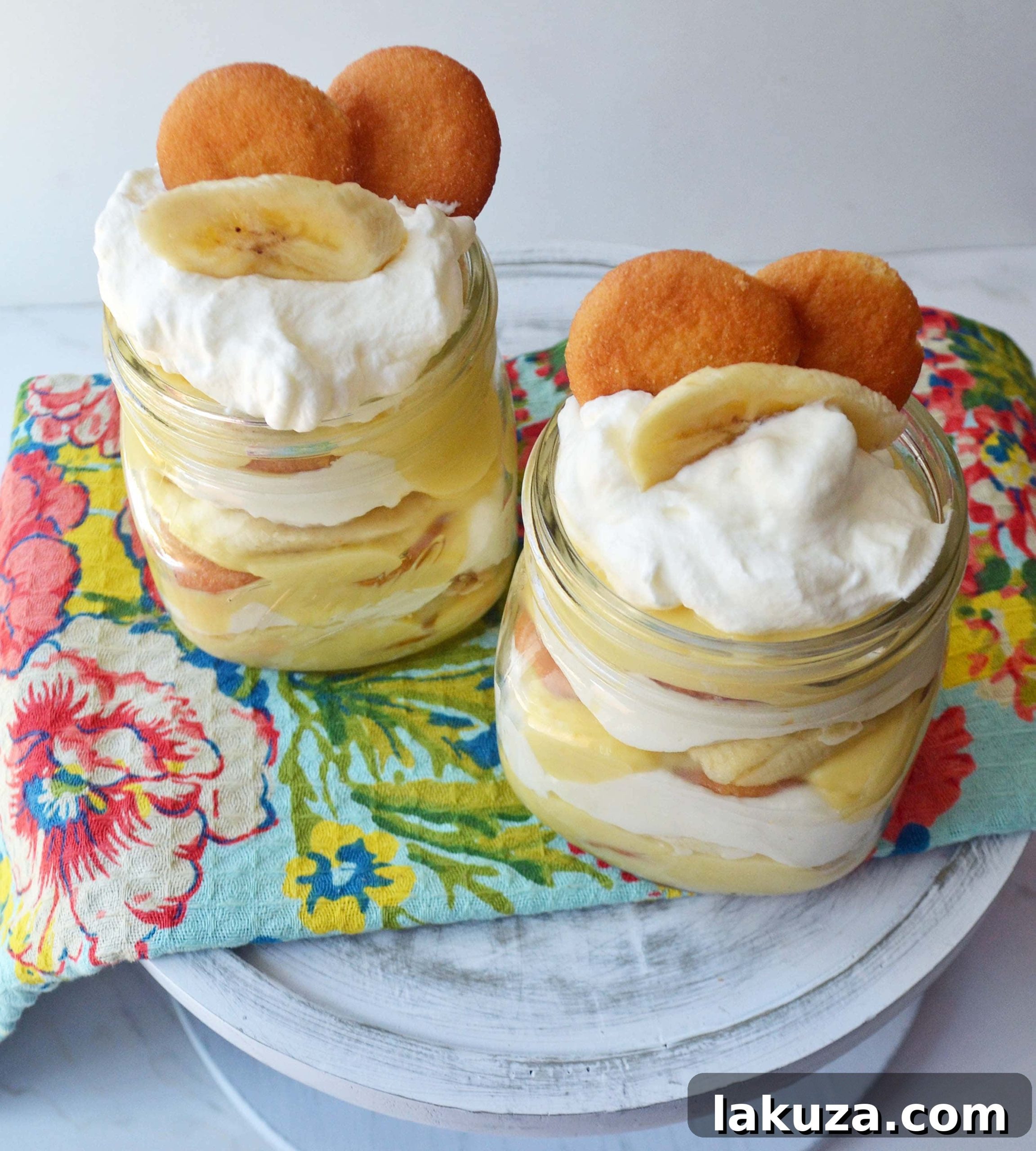 Classic Homemade Banana Pudding Dessert made with a silky vanilla bean custard, layered with tender Nilla wafers, perfectly sliced ripe bananas, and crowned with a cloud of homemade whipped cream. A true Southern comfort food recipe.