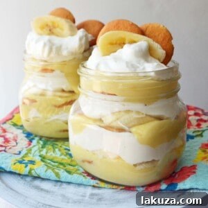 Homemade Banana Pudding Dessert Recipe. Slow cooked vanilla bean custard layered with fresh bananas, nilla wafers and fluffy whipped cream. A perfect Southern dessert and homemade Magnolia Bakery copycat with made from scratch pudding. www.modernhoney.com