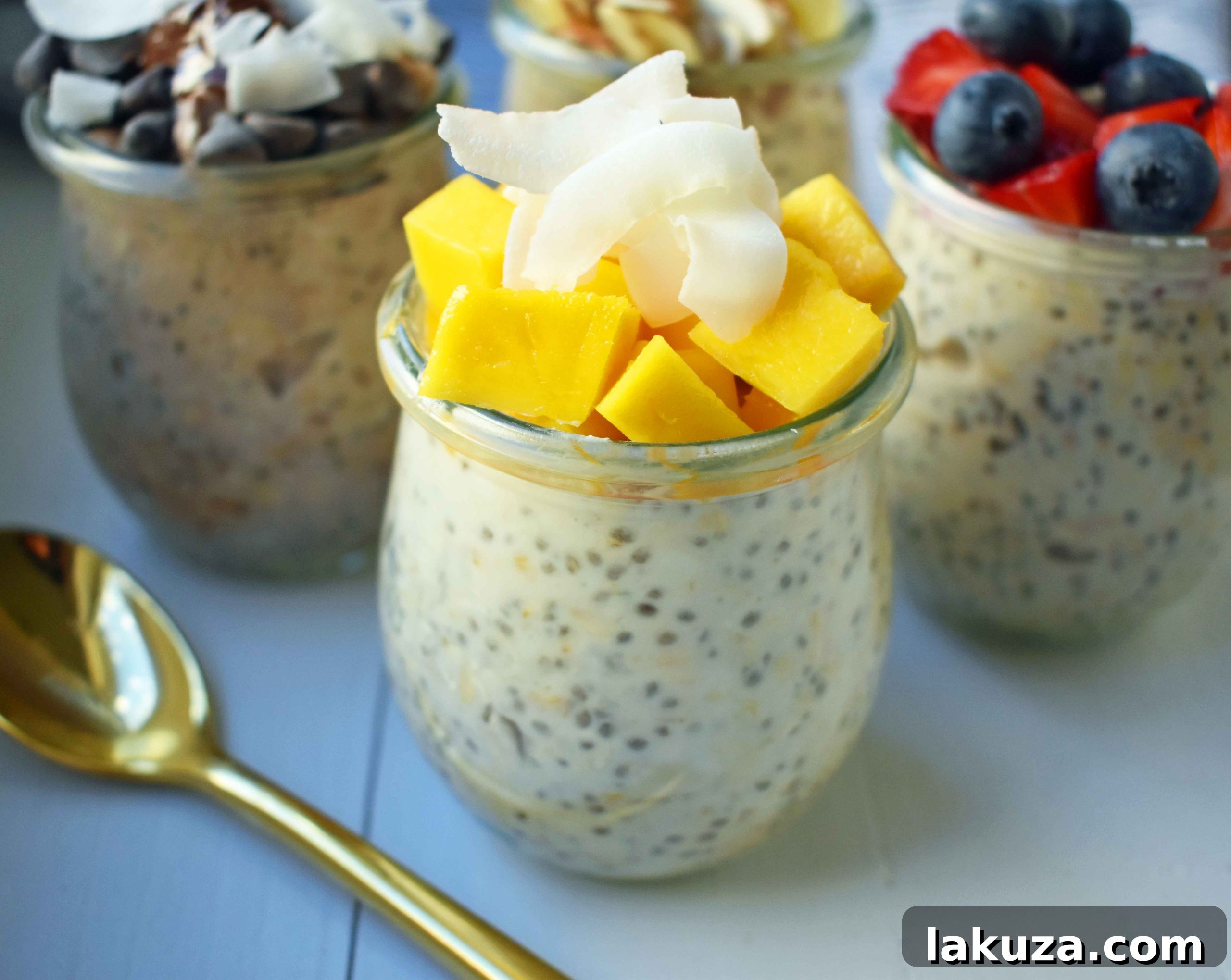 Close-up of overnight oats topped with banana slices, chocolate chips, and coconut flakes, highlighting a delicious flavor combination.