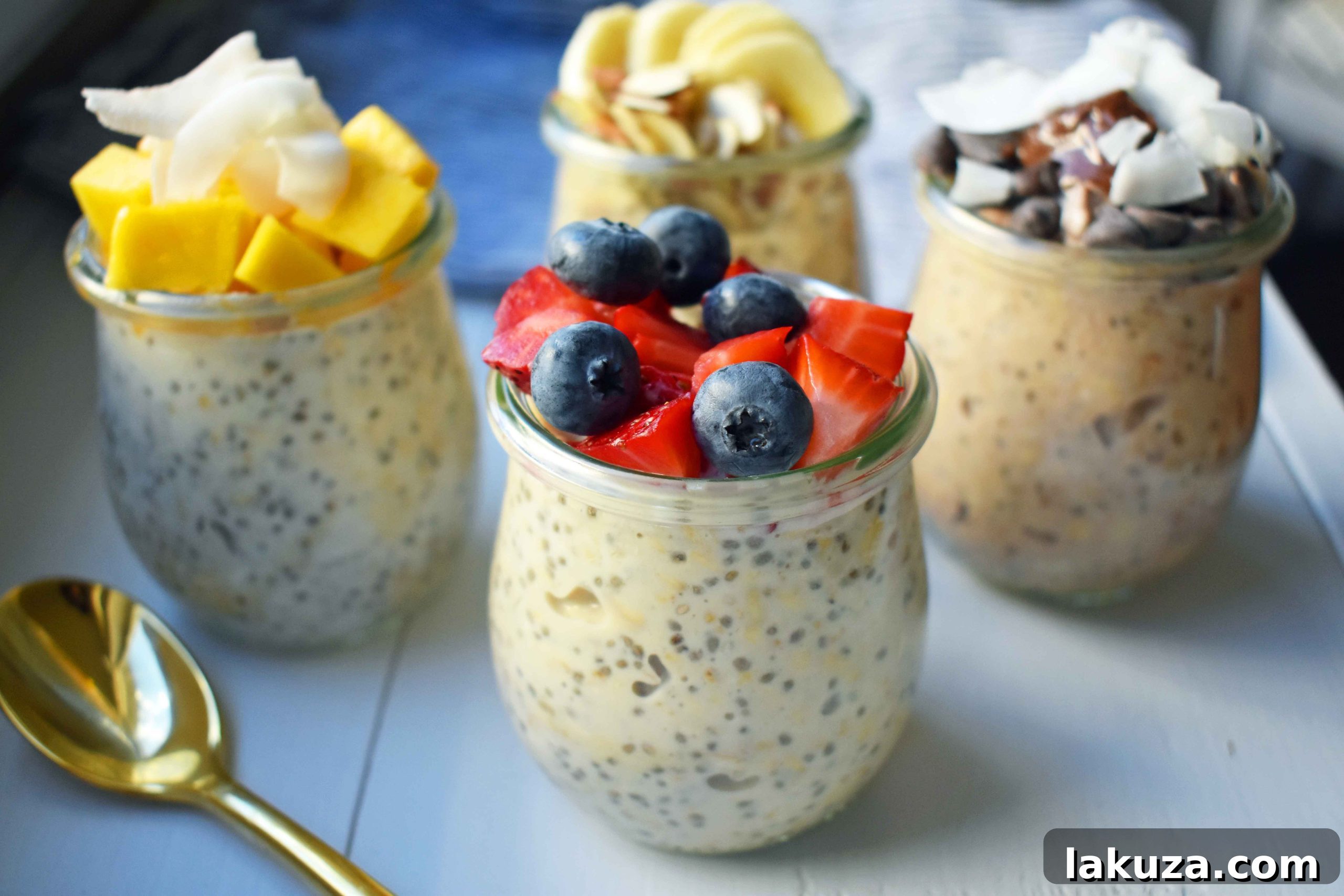 A vibrant display of five different overnight oats recipes, showcasing their delicious and healthy toppings like berries, chocolate, bananas, and coconut.
