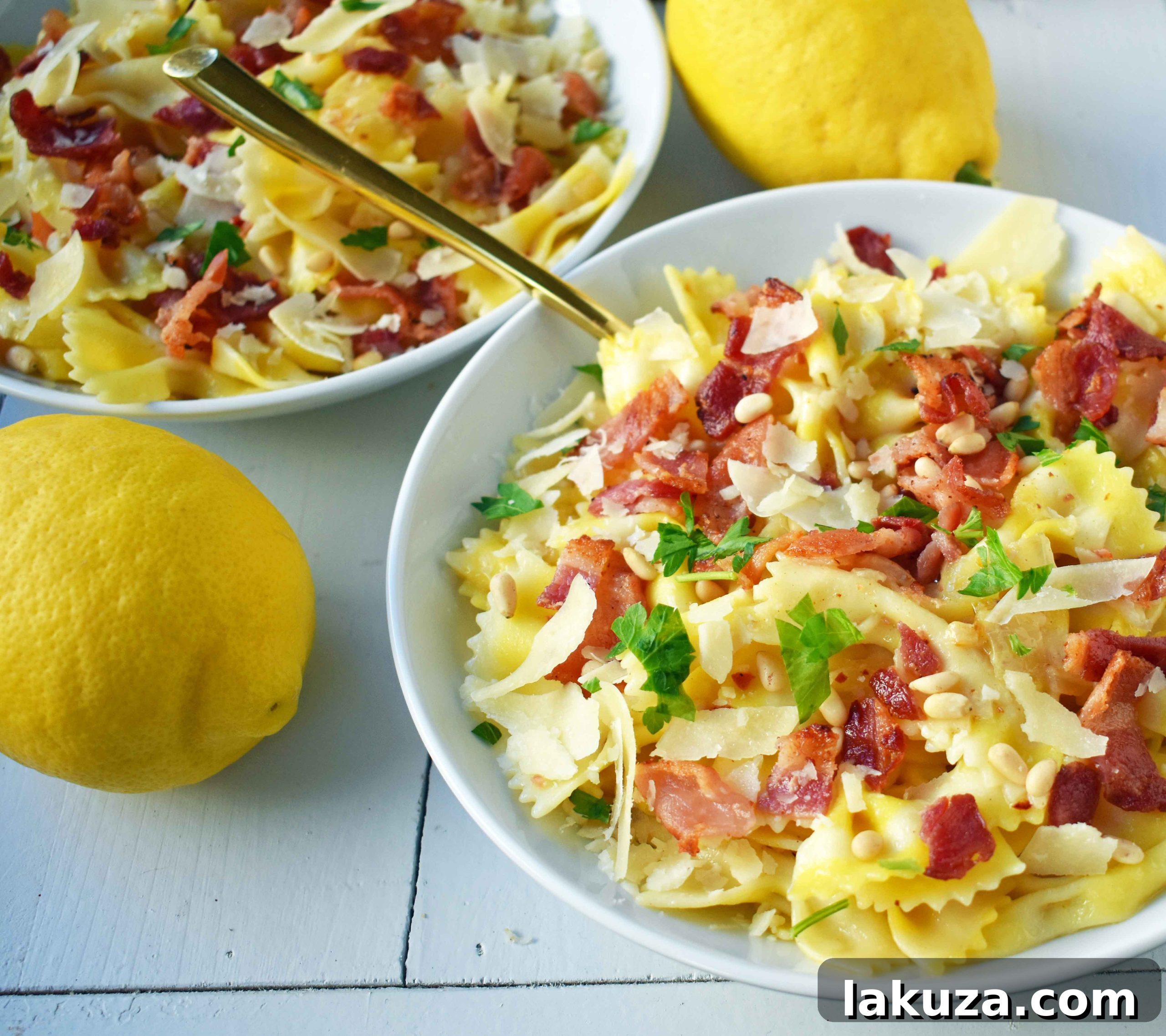 Bright Lemon Garlic Pasta with Crispy Bacon 5 A serving of Lemon Garlic and Crispy Bacon Pasta, beautifully plated. The farfalle pasta is mixed with golden sauce, topped with crunchy bacon, rich Parmesan, and green herbs. The overall image evokes a sense of fresh, home-cooked comfort food.