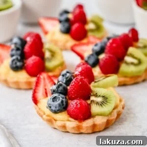 Fresh Fruit Tart with Vanilla Pastry Cream: a French dessert featuring a flaky crust, vanilla custard, and fresh fruits.