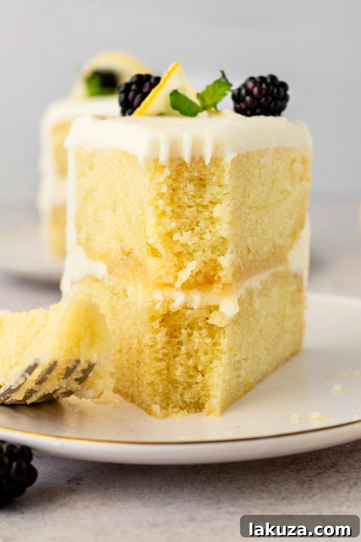 A close-up shot of the perfectly moist and fluffy interior of a Lemon Olive Oil Cake, showcasing its tender crumb texture.