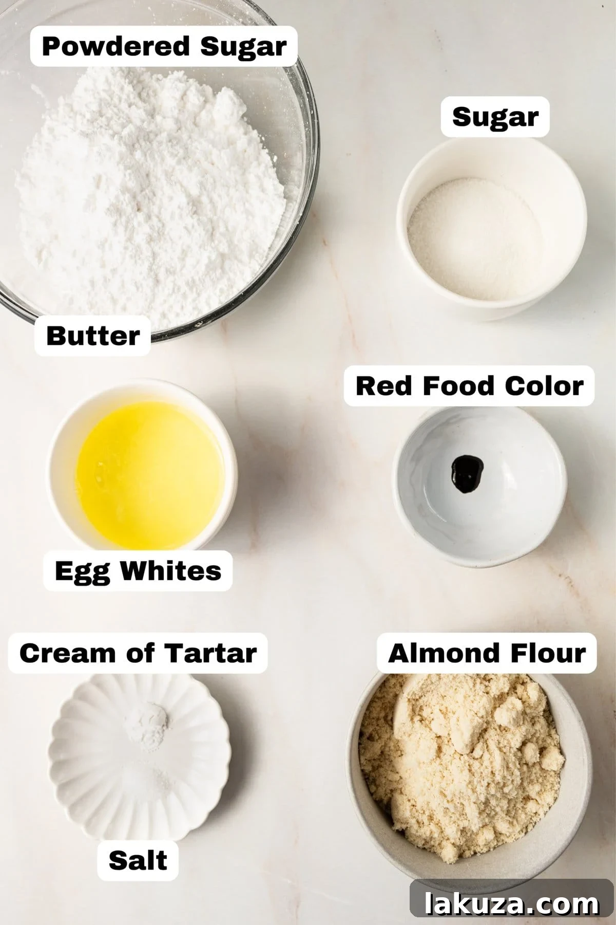 Elegant Macaron Delights 4 Key ingredients for making homemade French macarons, including almond flour, egg whites, and sugar.