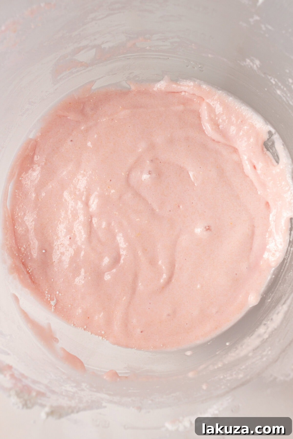 Elegant Macaron Delights 8 Homemade macaron batter with the perfect 'macaronage' consistency, ready for piping.