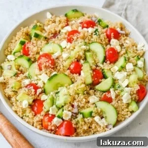 A light and healthy quinoa salad made with quinoa, crunchy cucumbers, fresh tomatoes, crisp red onion, and tangy feta tossed in a red wine vinaigrette. The perfect side dish or healthy meal!