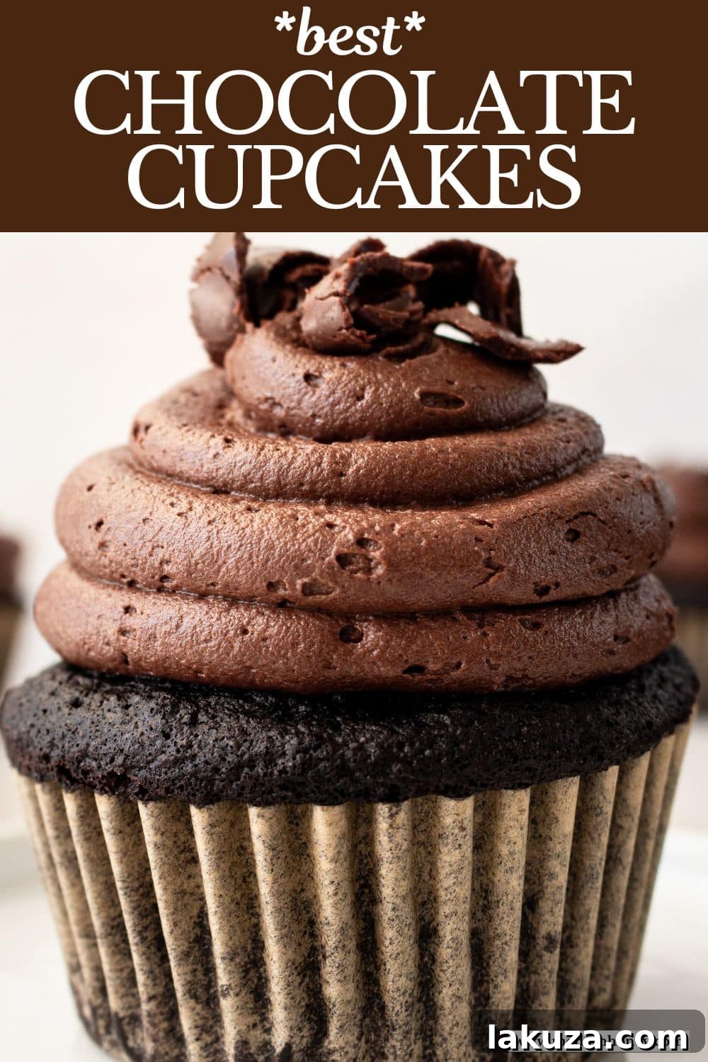 Decadent Chocolate Cupcakes 15 A beautifully composed flat lay image showcasing two perfectly frosted chocolate cupcakes on a white surface, ready to be enjoyed as a delightful treat.
