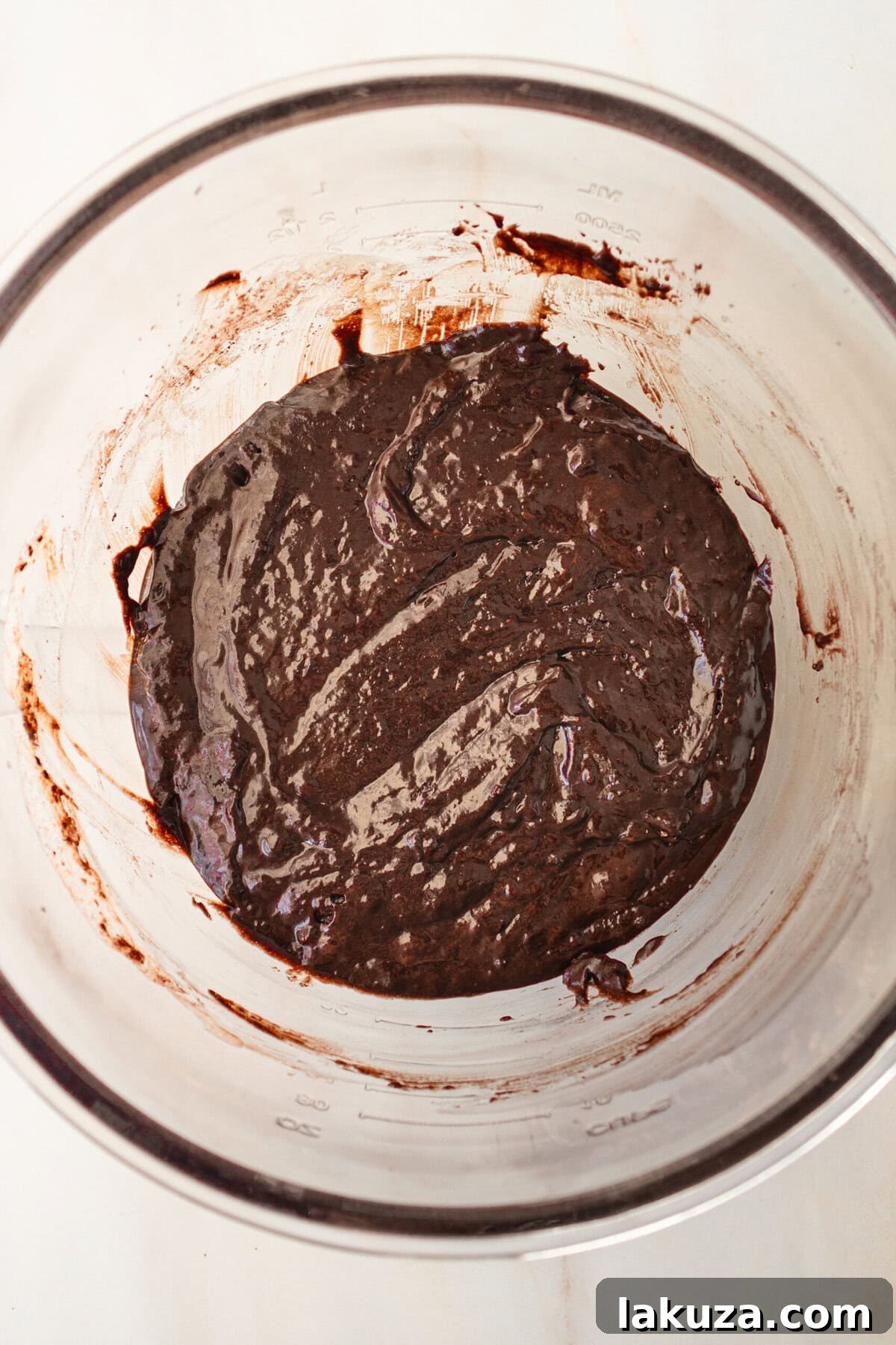 Decadent Chocolate Cupcakes 9 Smooth, rich chocolate cupcake batter in a mixing bowl, ready to be poured into liners.