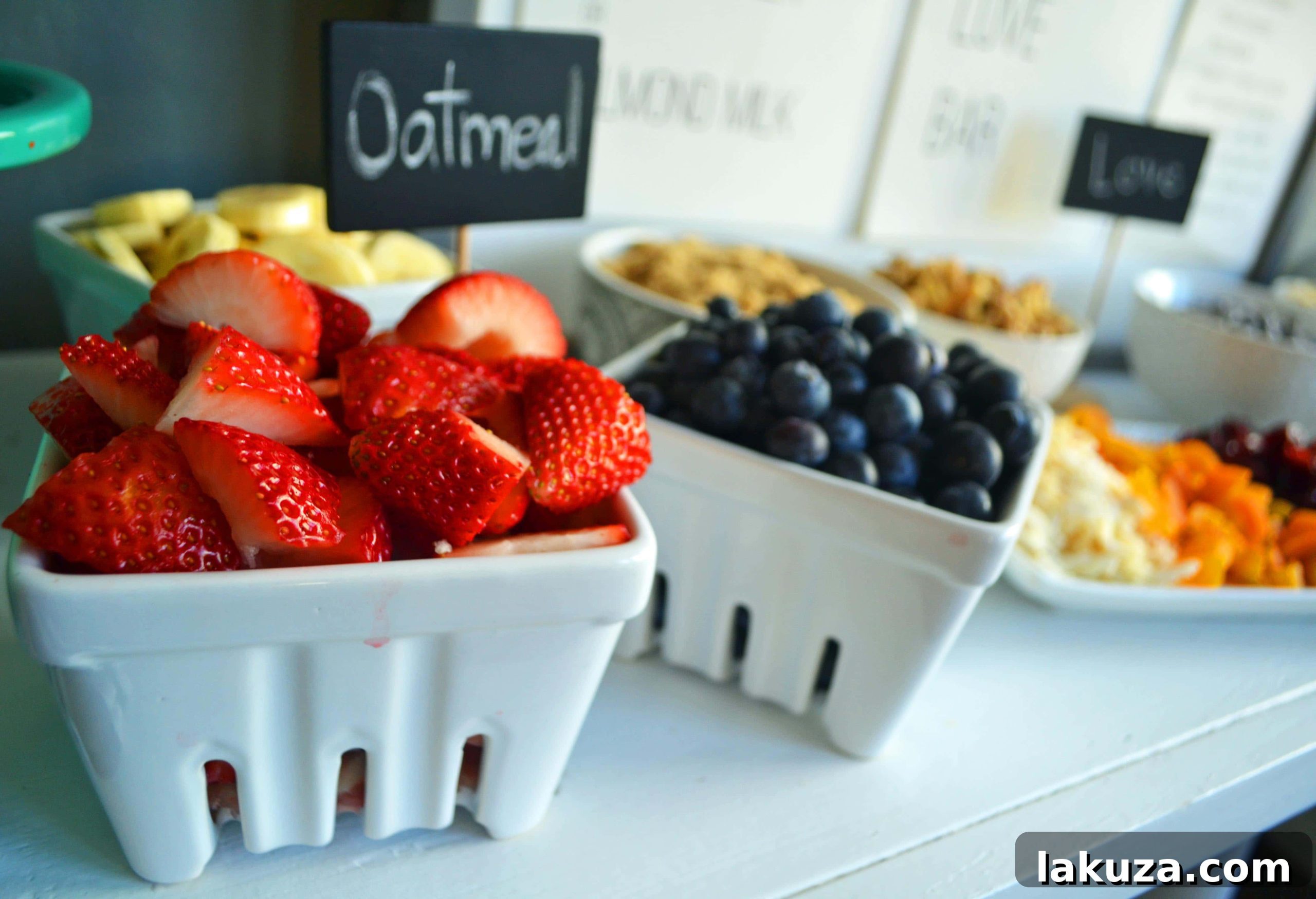 Craft Your Oat Creation 14 A beautifully set oatmeal bar by Modern Honey, featuring various toppings in elegant dishes, perfect for a brunch.