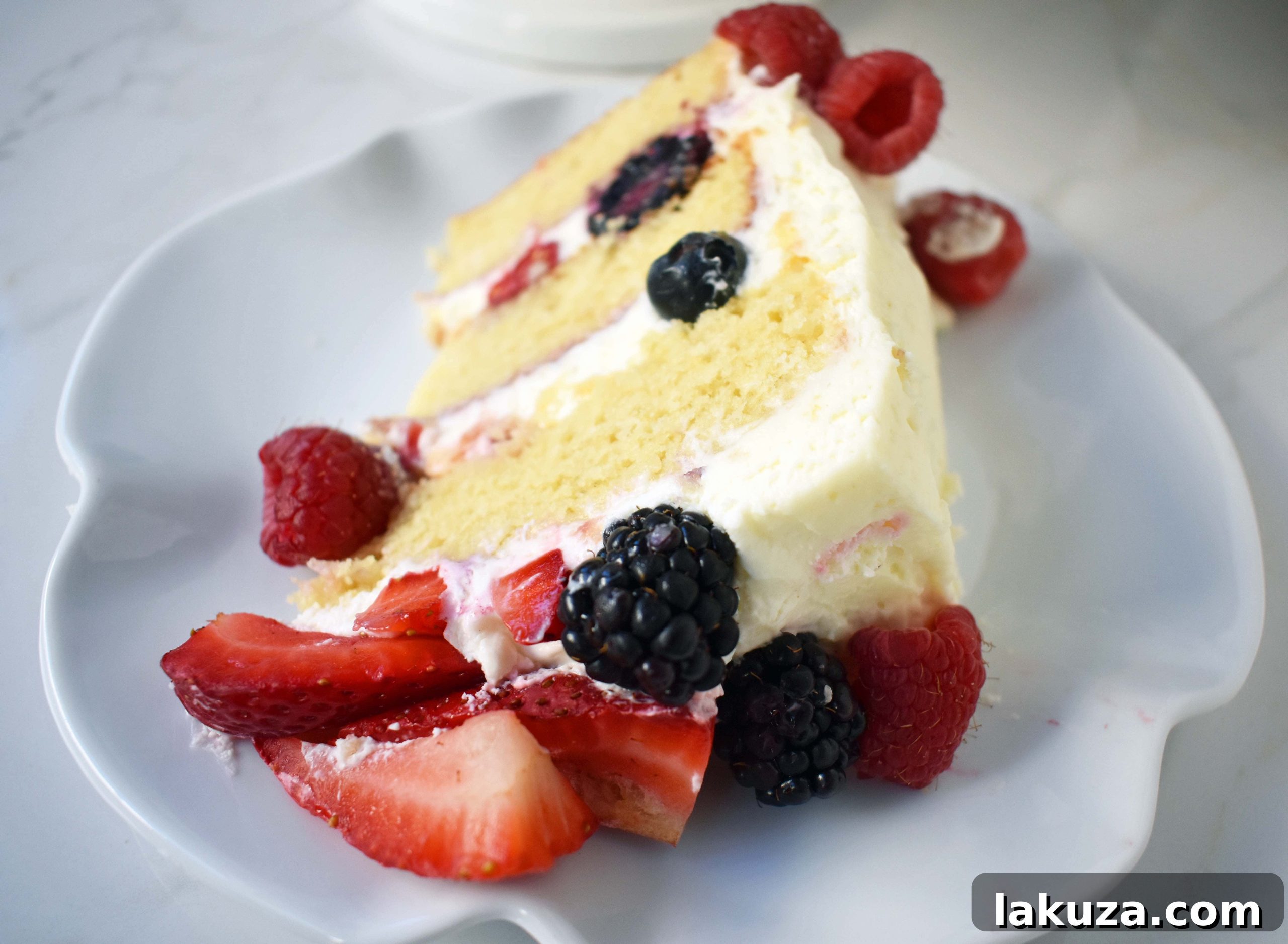 Berry Chantilly Cake 17 A whole Berry Chantilly Cream Cake adorned with berries, perfect for a spring or summer celebration.