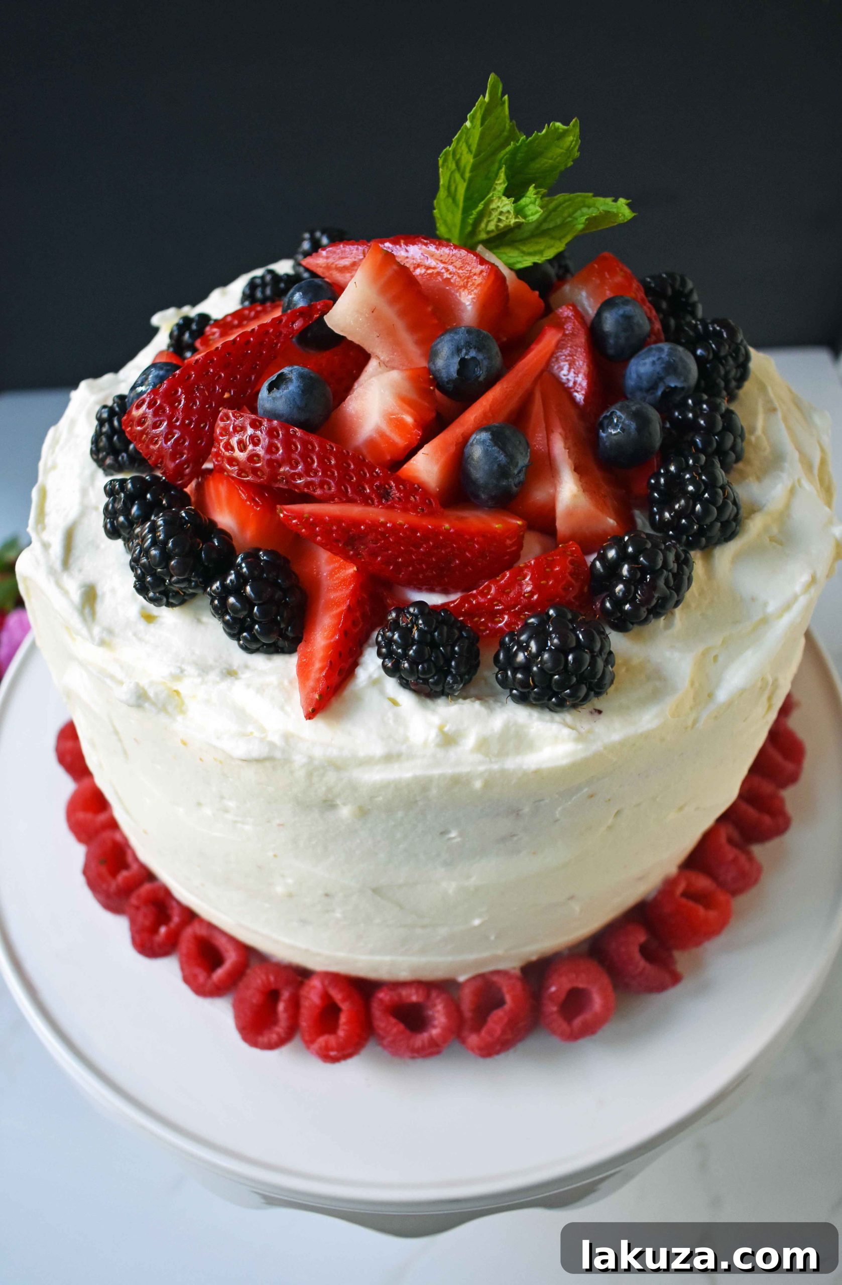 Berry Chantilly Cake 19 Berry Chantilly Cream Cake, beautifully decorated with an abundance of fresh fruit, a perfect centerpiece for any celebration.