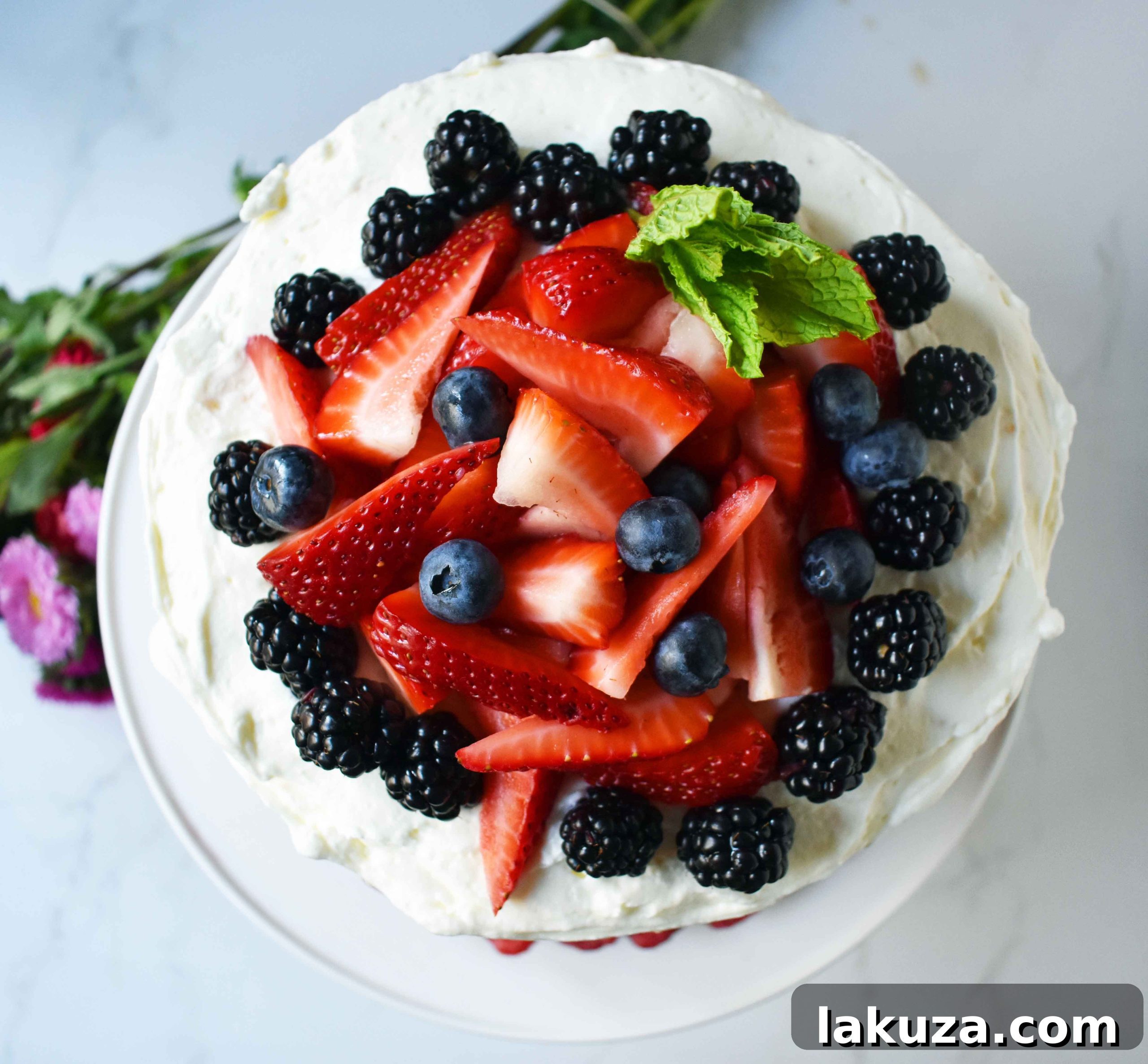 Berry Chantilly Cake 20 A close-up of a Berry Chantilly Cream Cake, showcasing the detailed layering and vibrant fresh berries, perfect for a spring or summer dessert.