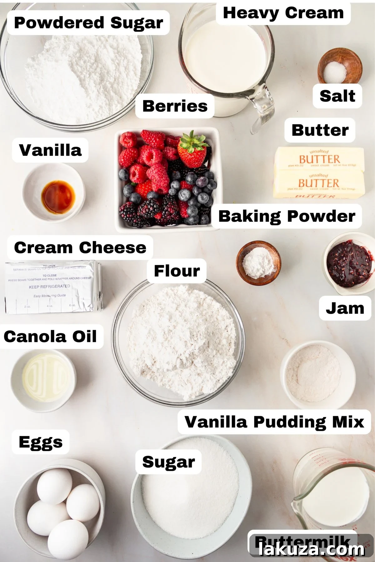 Berry Chantilly Cake 8 Assortment of fresh ingredients for Berry Chantilly Cake including eggs, milk, flour, sugar, butter, heavy cream, cream cheese, and a medley of berries.