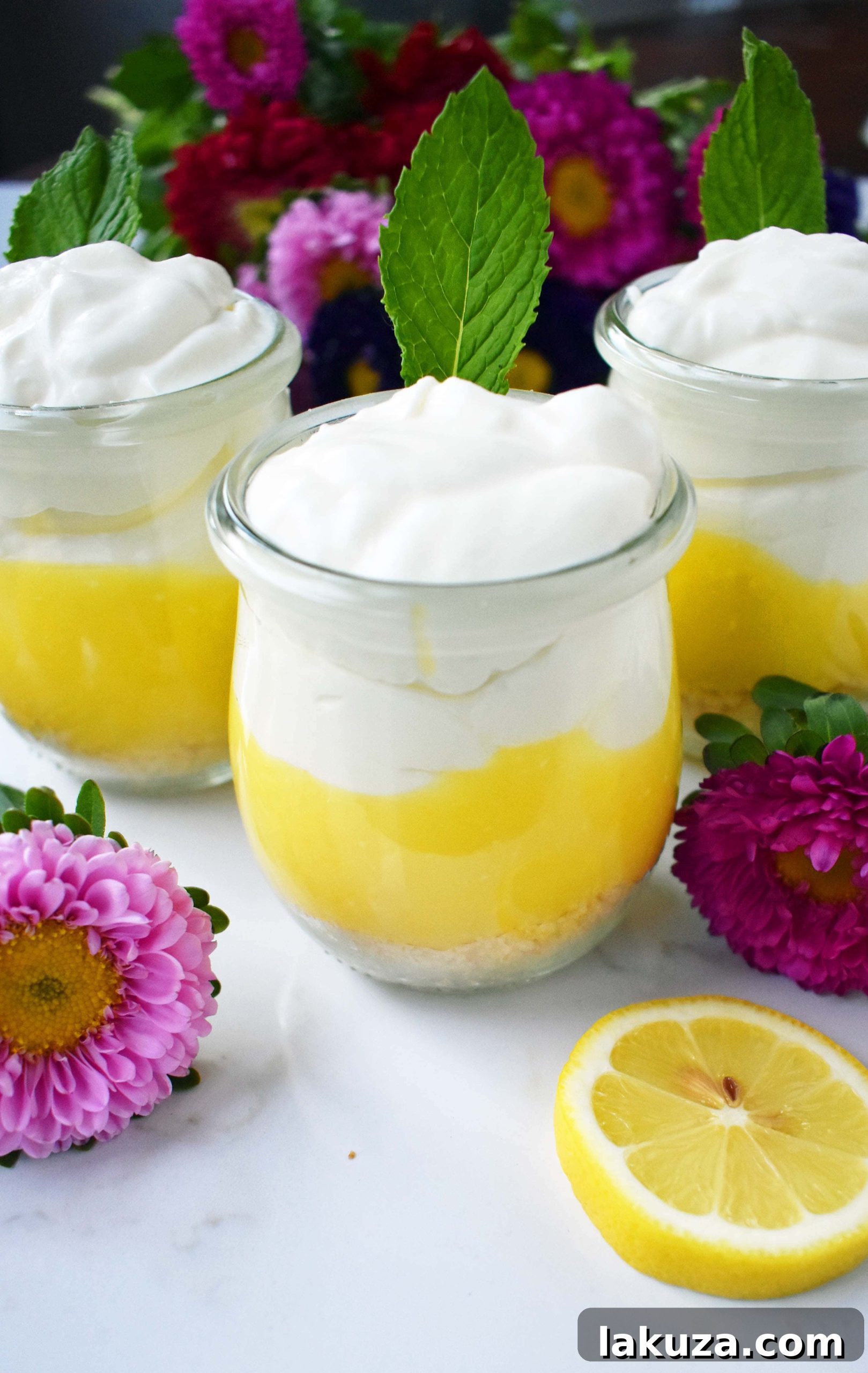 Sunshine Lemon Parfait Jars 6 Variety of Lemon Cream Parfait Pie Jars displayed, some with fresh mint leaves and lemon slices for garnish, highlighting their appeal as individual dessert portions.