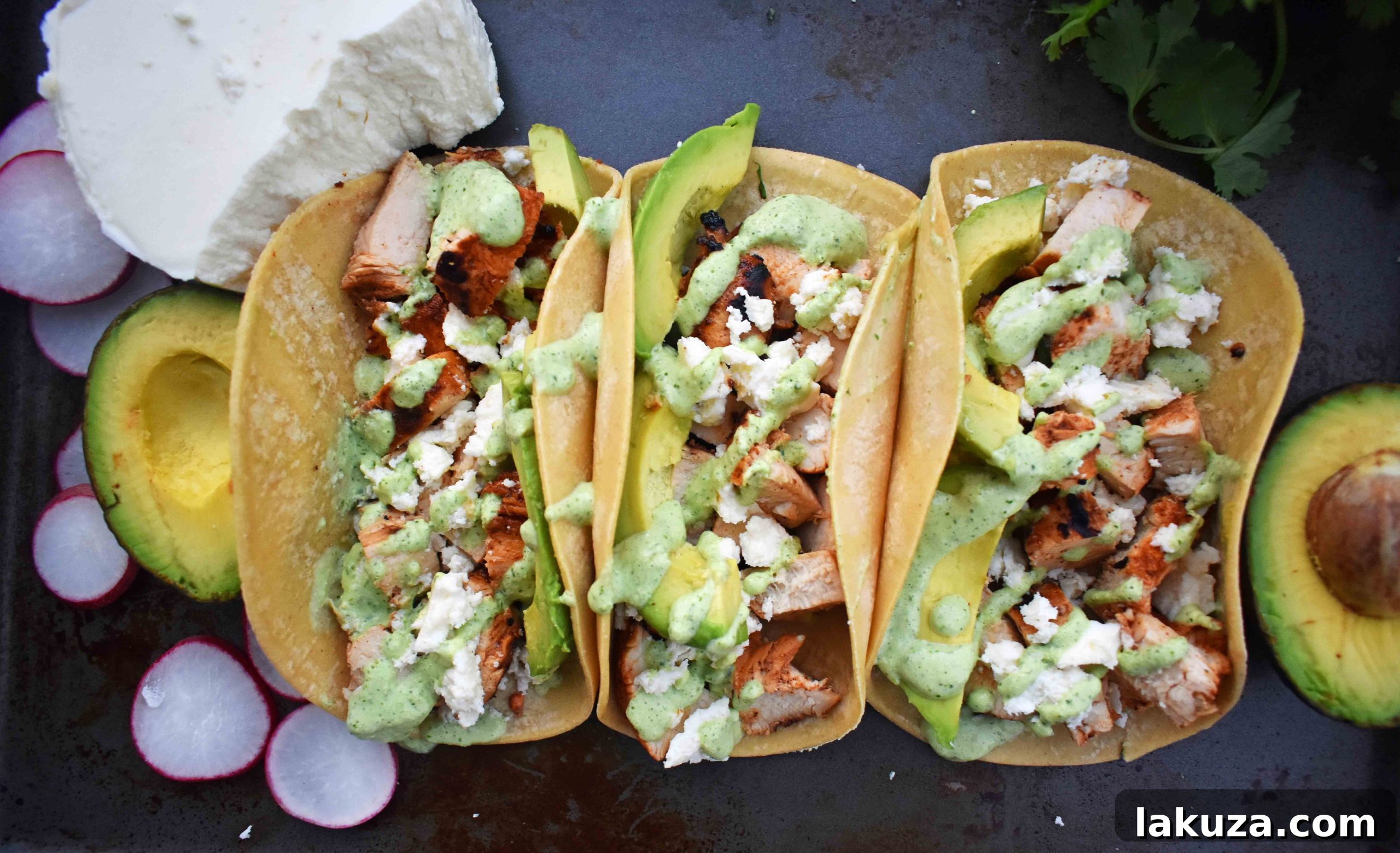 Grilled Chicken Tacos with Roasted Poblano Lime Crema 5 Grilled poblano peppers for the crema, charring on an outdoor grill.