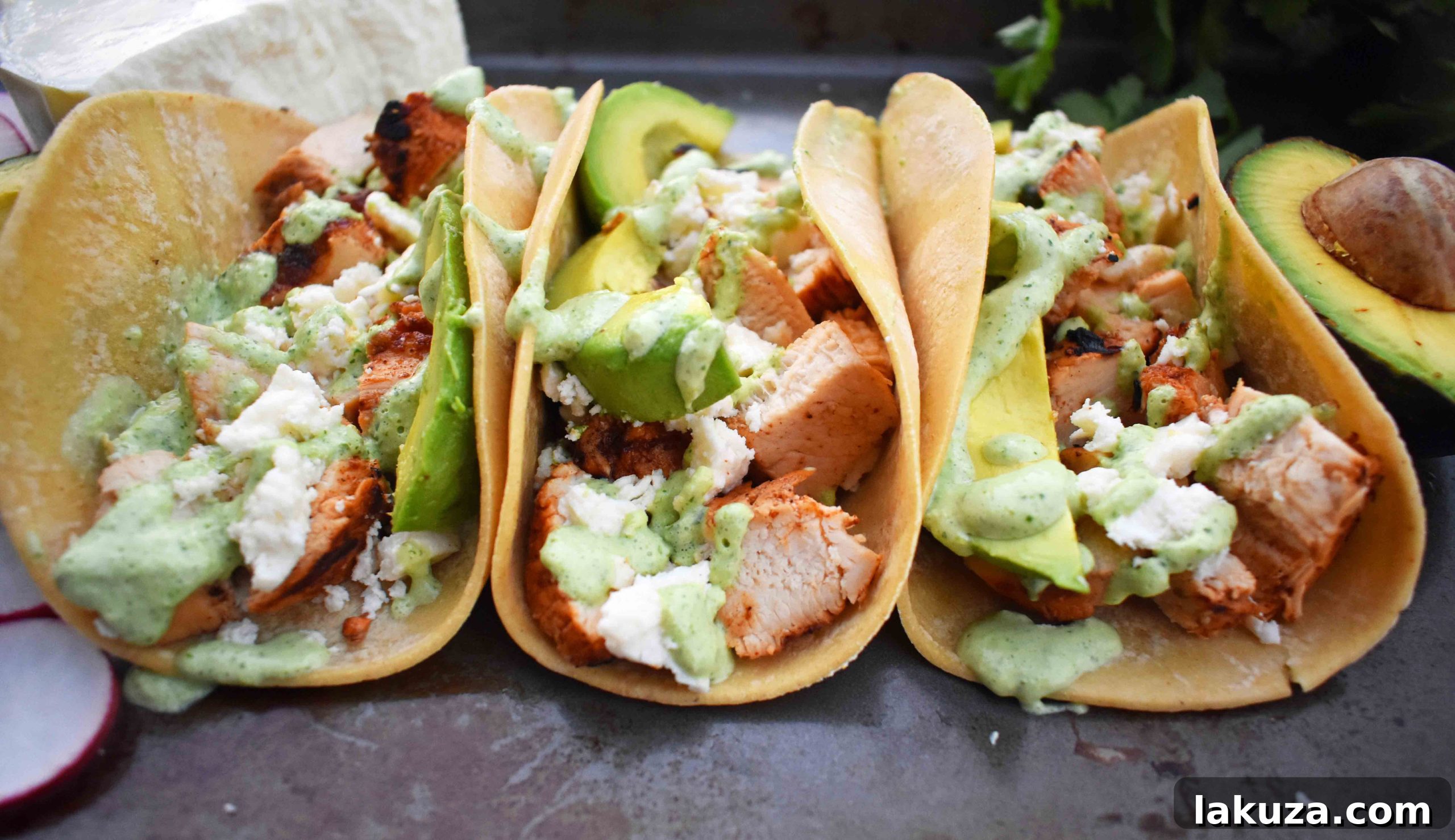 Grilled Chicken Tacos with Roasted Poblano Lime Crema 6 Expertly assembled grilled chicken tacos with roasted poblano crema, avocado, and queso fresco.
