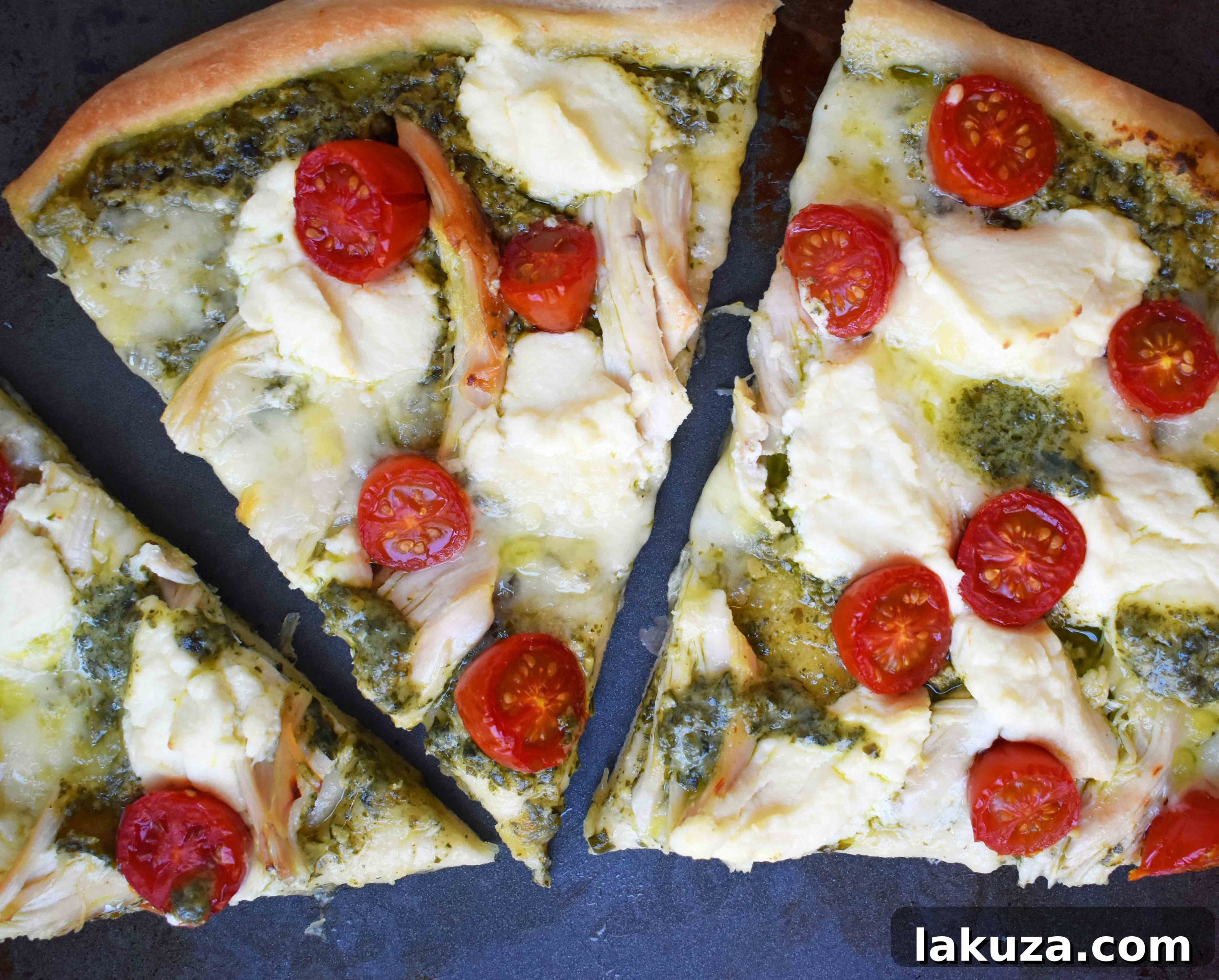Close-up of ingredients for Chicken Pesto Pizza including pesto, chicken, and cheeses.