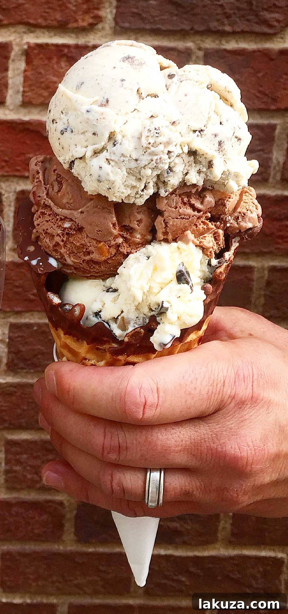 Disneyland's Gastronomic Gold: Essential Eats & Sweet Treats 14 A delicious Gibson Ice Cream Chocolate Dipped Waffle Cone at Disneyland, freshly made and dipped in rich chocolate for a classic treat.