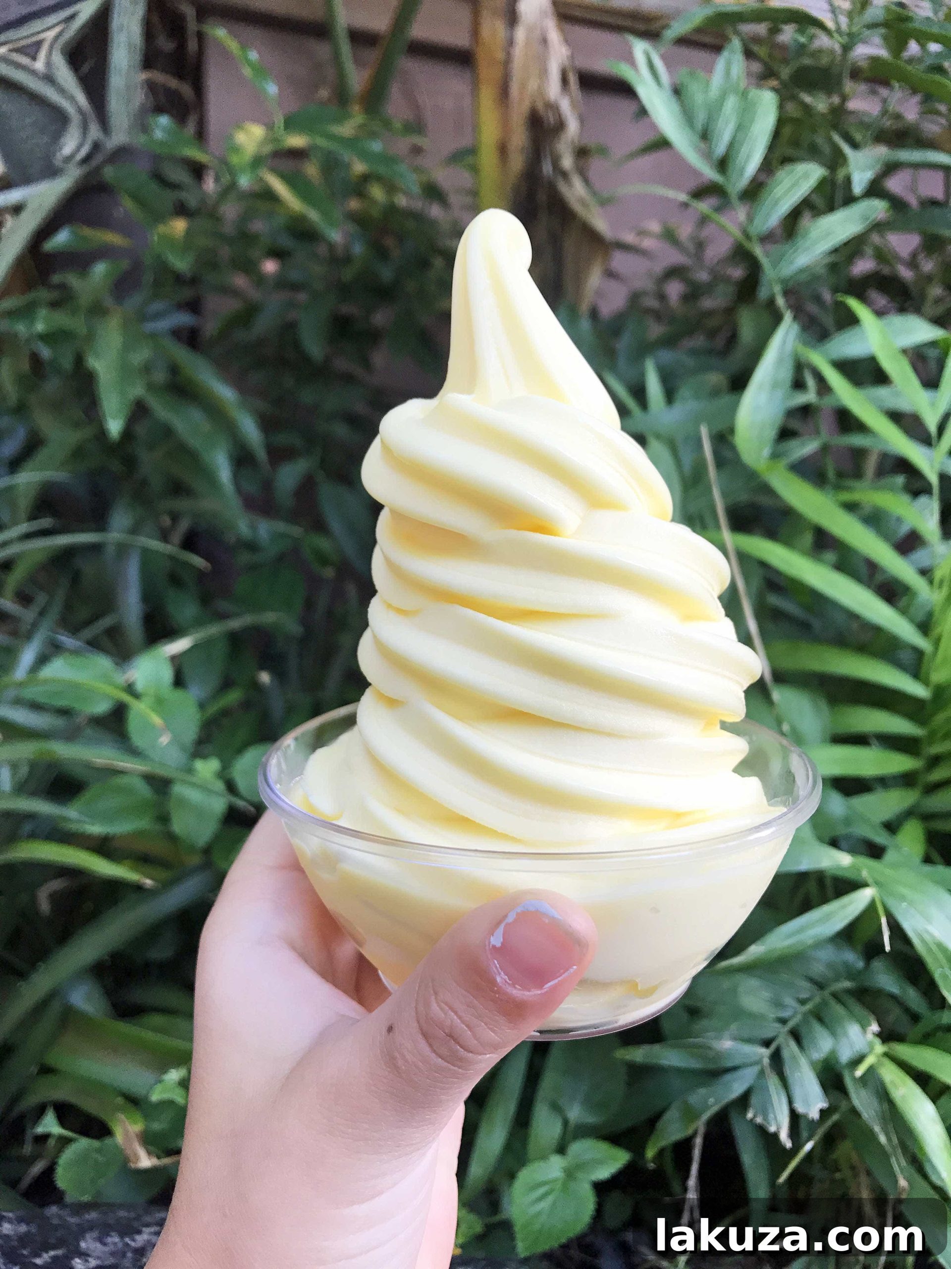 Disneyland's Gastronomic Gold: Essential Eats & Sweet Treats 9 The famous Dole Whip soft-serve at Disneyland, a sweet and tangy pineapple treat, available at the Tiki Juice Bar for a refreshing break.