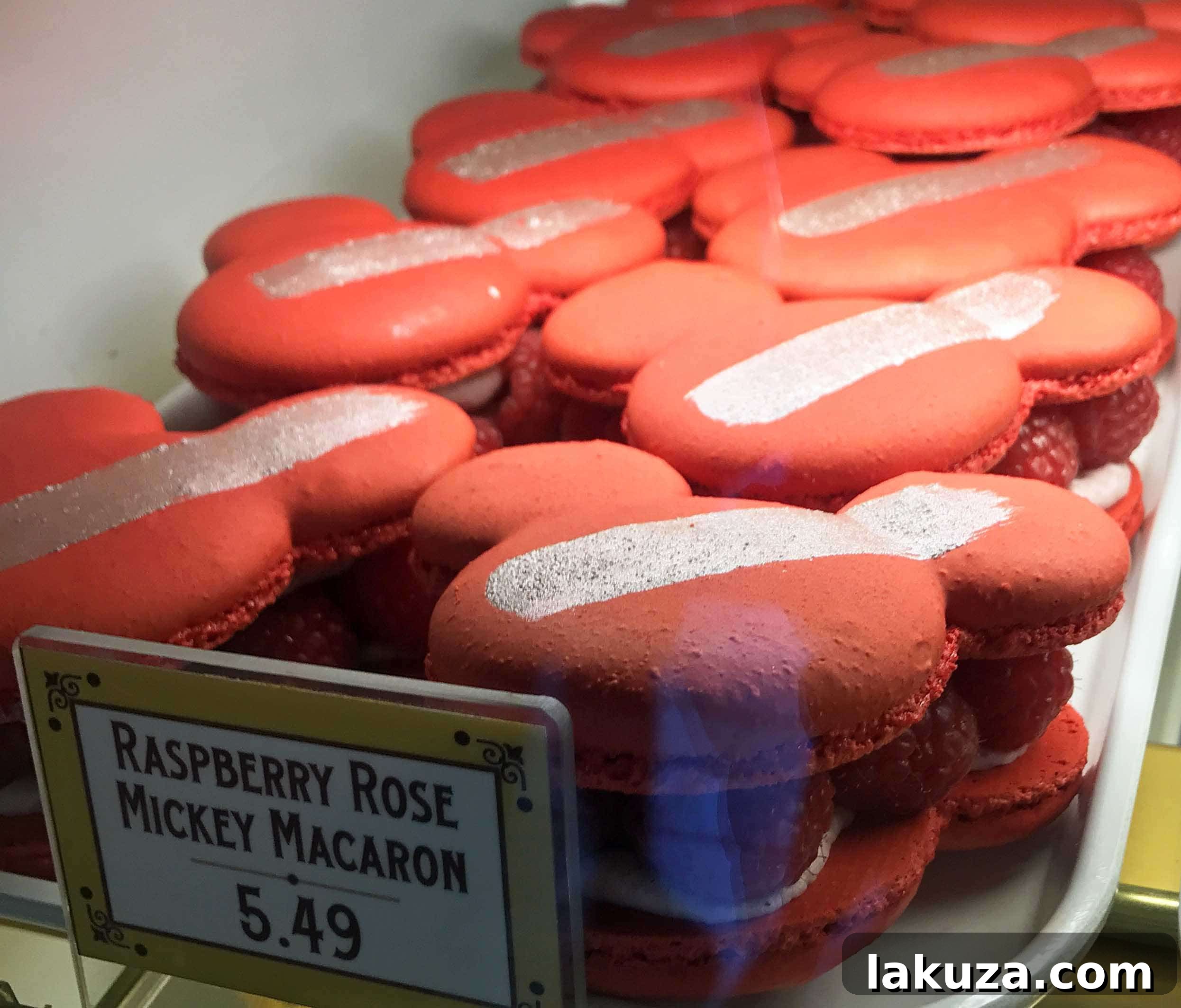 Disneyland's Gastronomic Gold: Essential Eats & Sweet Treats 12 A beautiful Raspberry Rose Mickey Macaron at Jolly Holiday Bakery Cafe in Disneyland, a delicate and flavorful seasonal treat.
