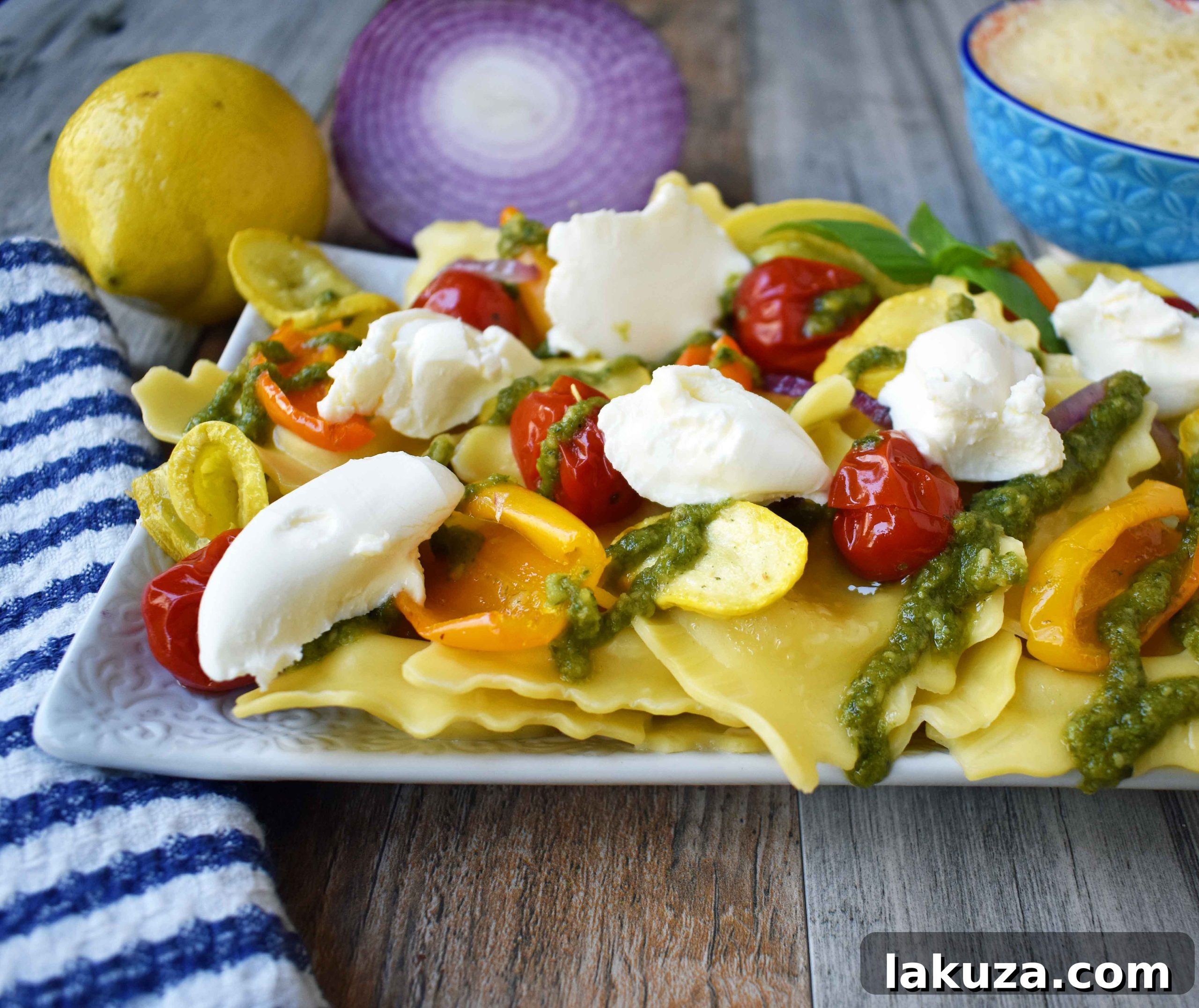 Fresh Ingredients for Summer Roasted Vegetable Pesto Ravioli - Highlighting fresh ravioli, colorful summer vegetables ready for roasting, and a jar of basil pesto sauce.