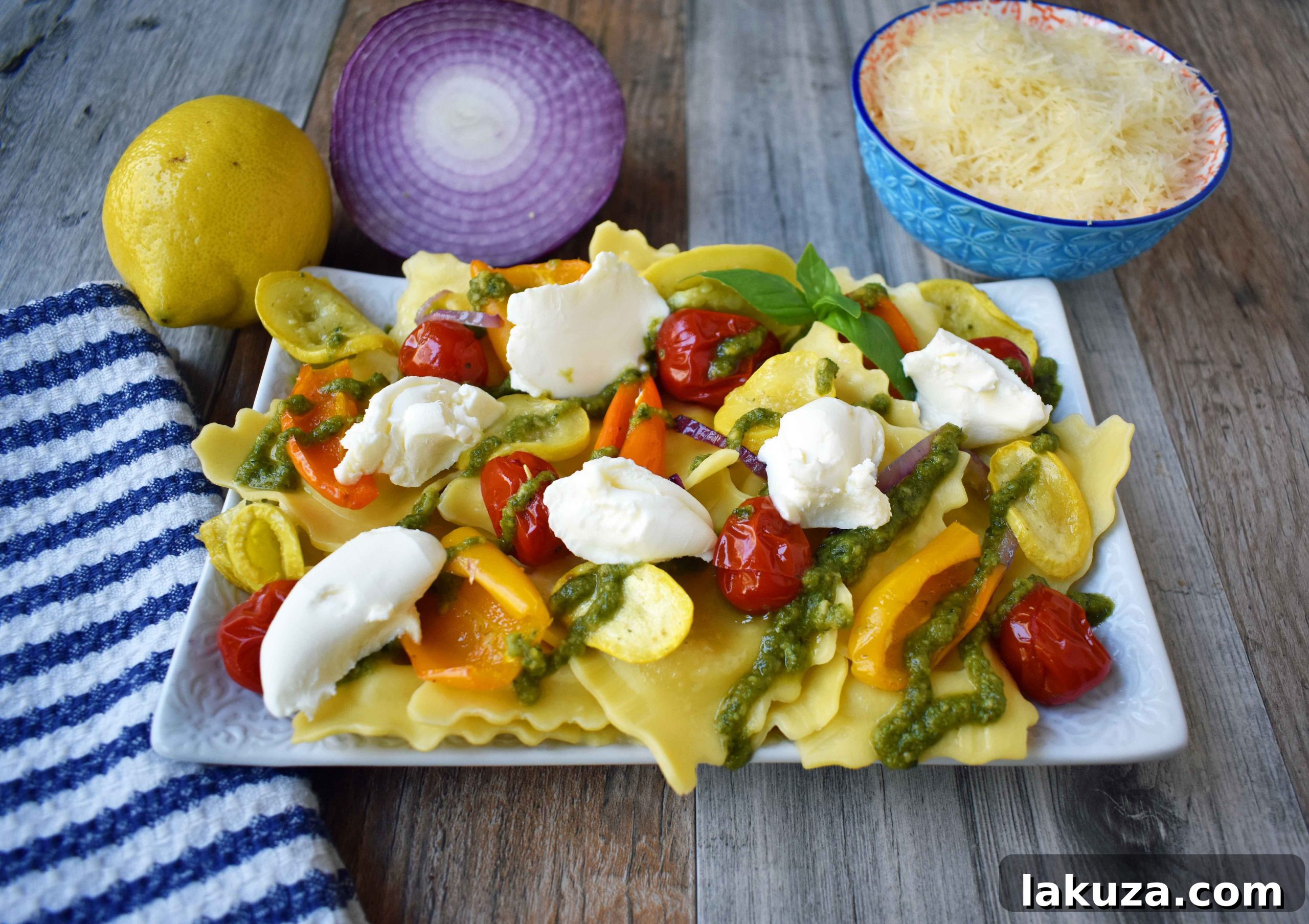 Close-up of Summer Roasted Vegetable Pesto Ravioli - A serving of pasta showcasing tender roasted vegetables, glistening pesto, and soft ravioli, ready to be enjoyed.