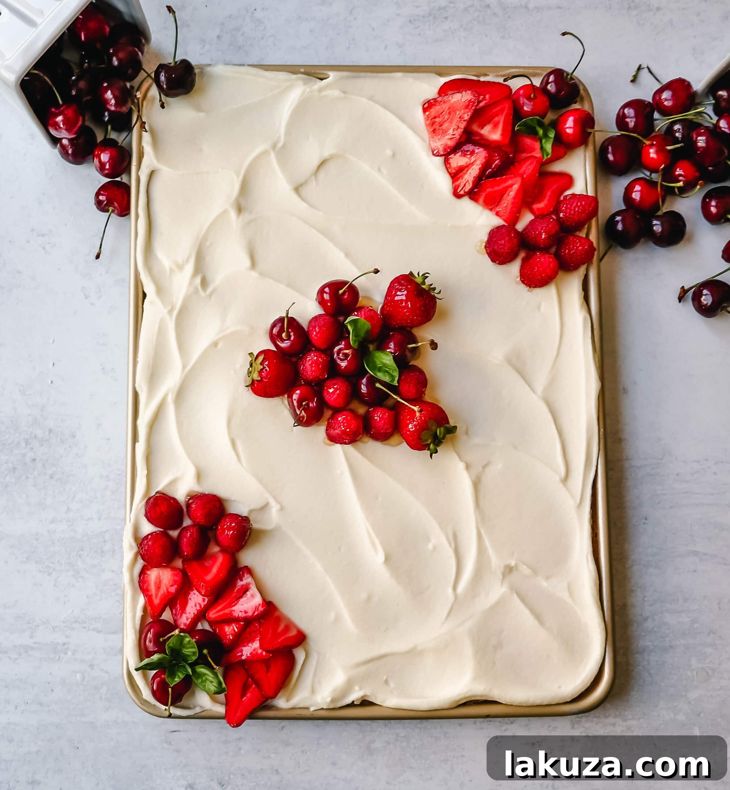 Southern Charm Vanilla Sheet Cake 2 A beautifully frosted White Texas Sheet Cake, showcasing its moist texture and creamy vanilla frosting, ready to be served.