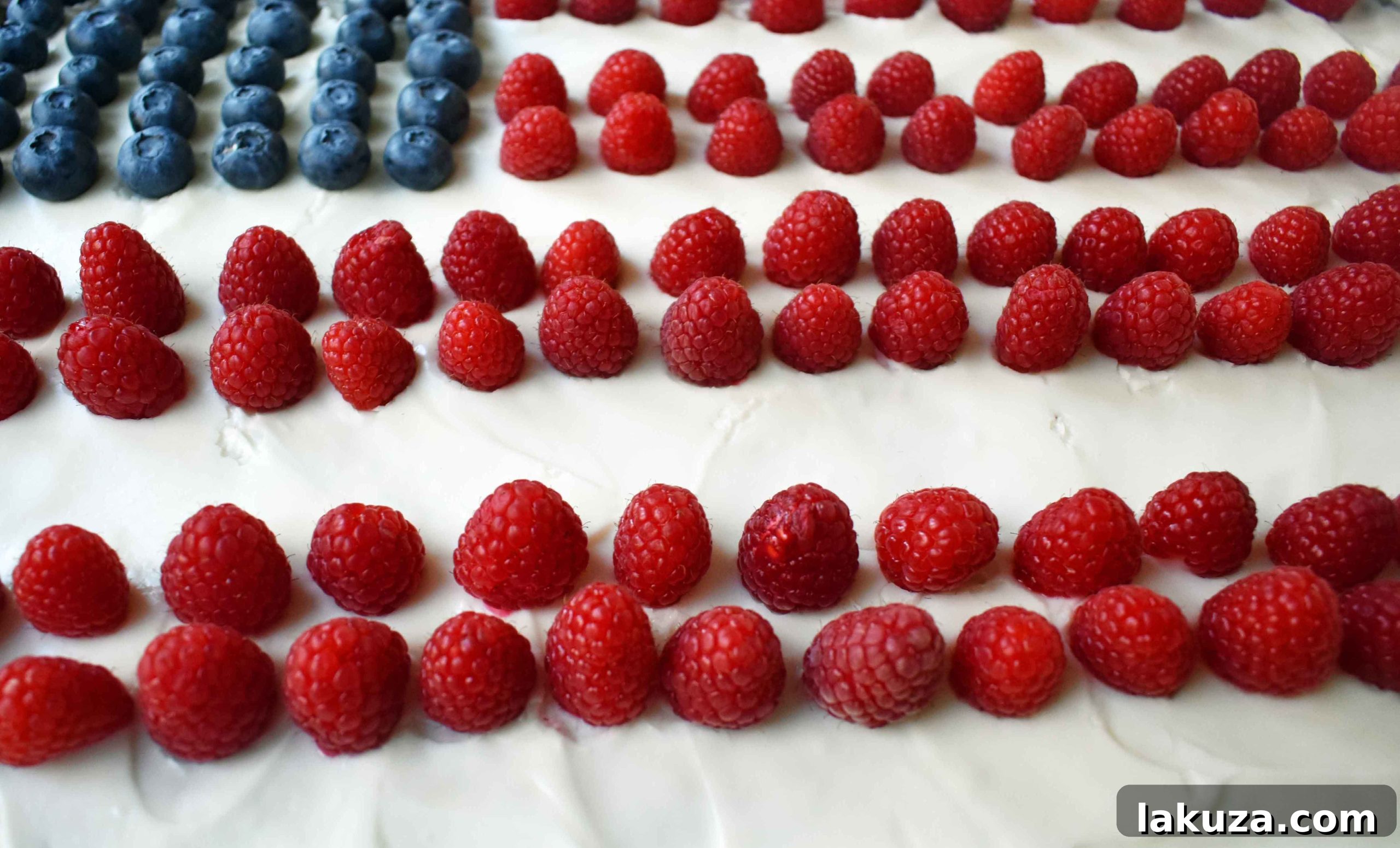 Southern Charm Vanilla Sheet Cake 9 Full view of the Vanilla Almond White Texas Sheet Cake with its creamy white frosting and scattered fresh berries.
