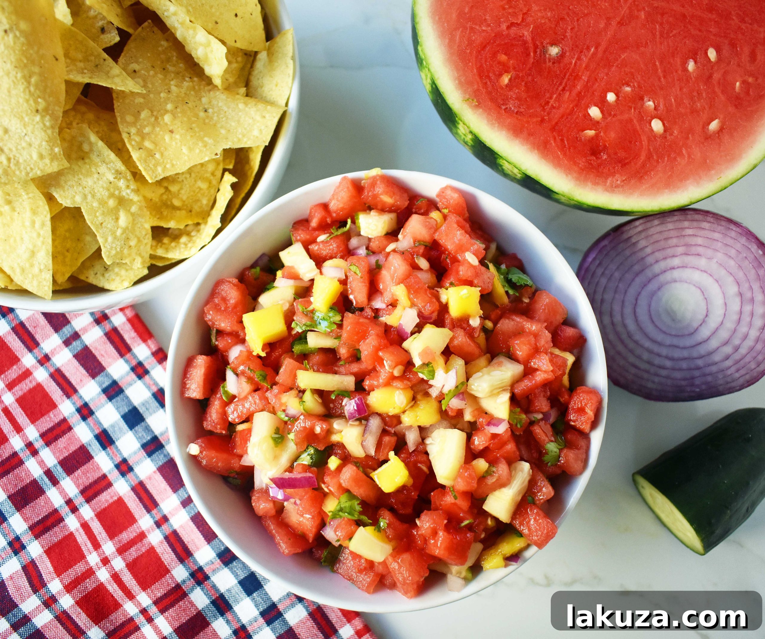 Close-up of Watermelon Mango Salsa featuring perfectly diced watermelon, mango, cucumber, red onion, cilantro, and jalapeño, highlighting its fresh and vibrant texture.