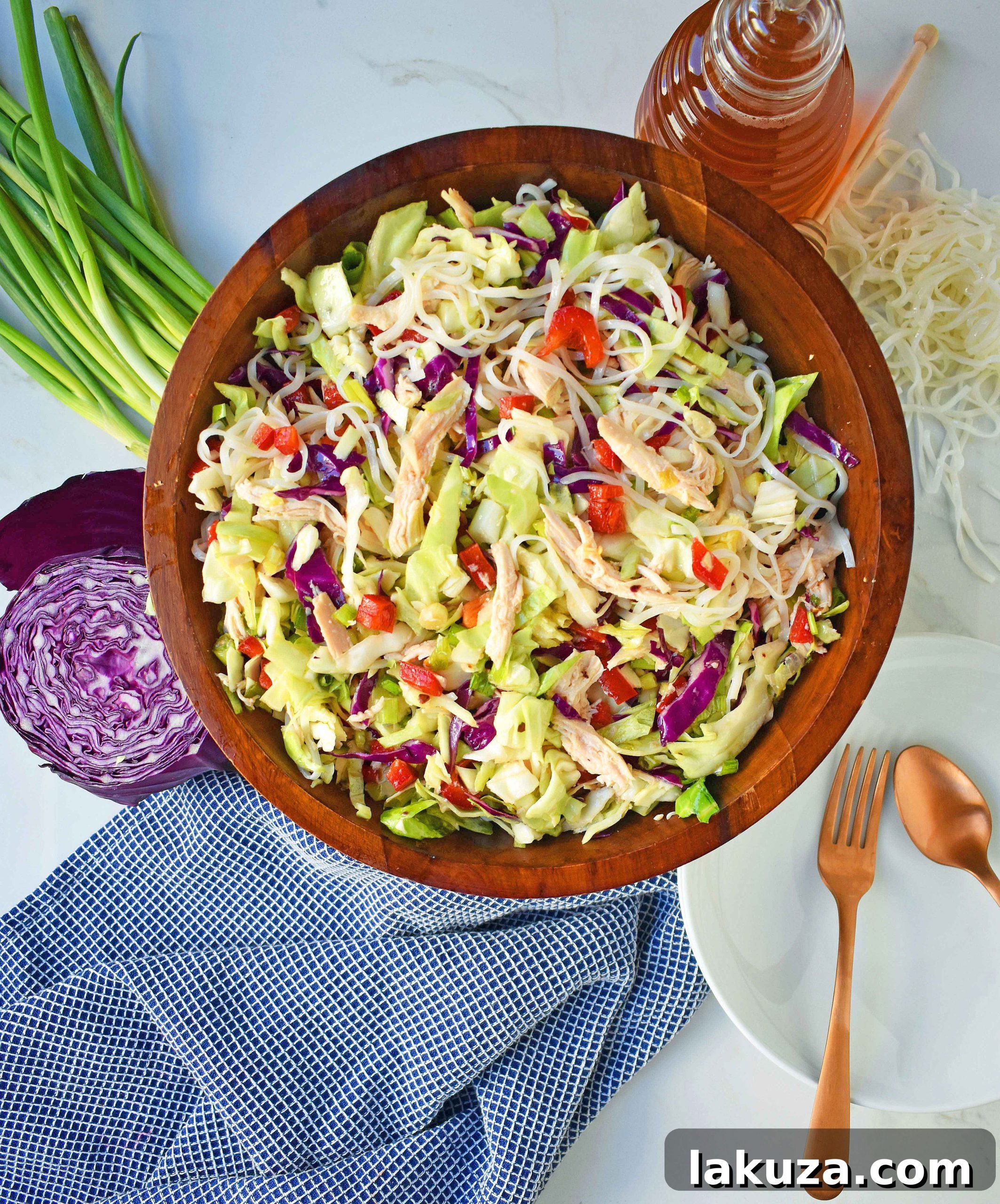 Chinese Chicken Salad with crunchy cabbage, tender chicken, green onions, red pepper, almonds, all tossed in a honey ginger dressing. May add rice or soba noodles if you so desire. A gluten- free and dairy-free Chinese Chicken Noodle Salad. A healthy salad that is perfect for a potluck. www.modernhoney.com