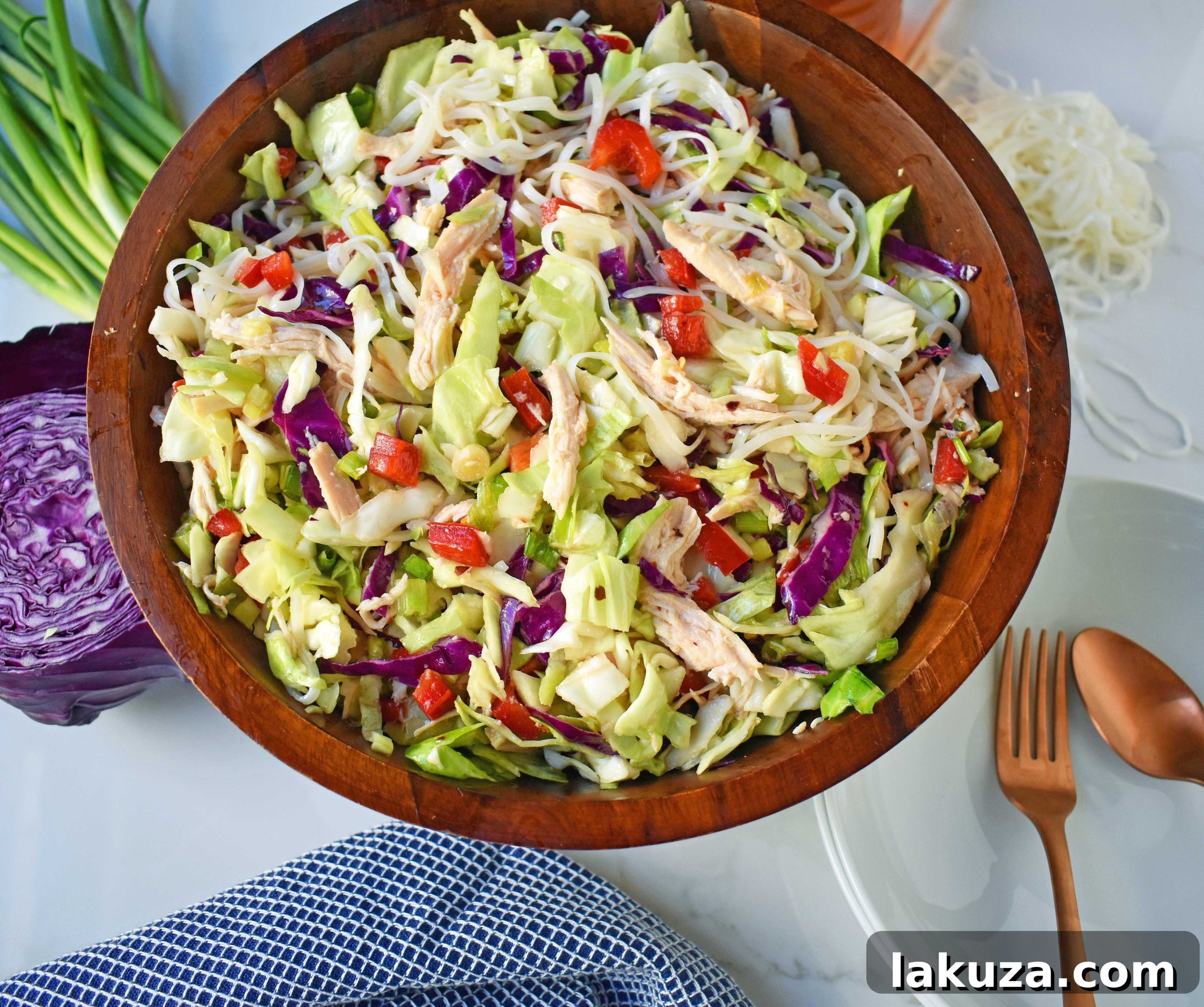Chinese Chicken Salad with crunchy cabbage, tender chicken, green onions, red pepper, almonds, all tossed in a honey ginger dressing. May add rice or soba noodles if you so desire. A gluten- free and dairy-free Chinese Chicken Noodle Salad. A healthy salad that is perfect for a potluck. www.modernhoney.com