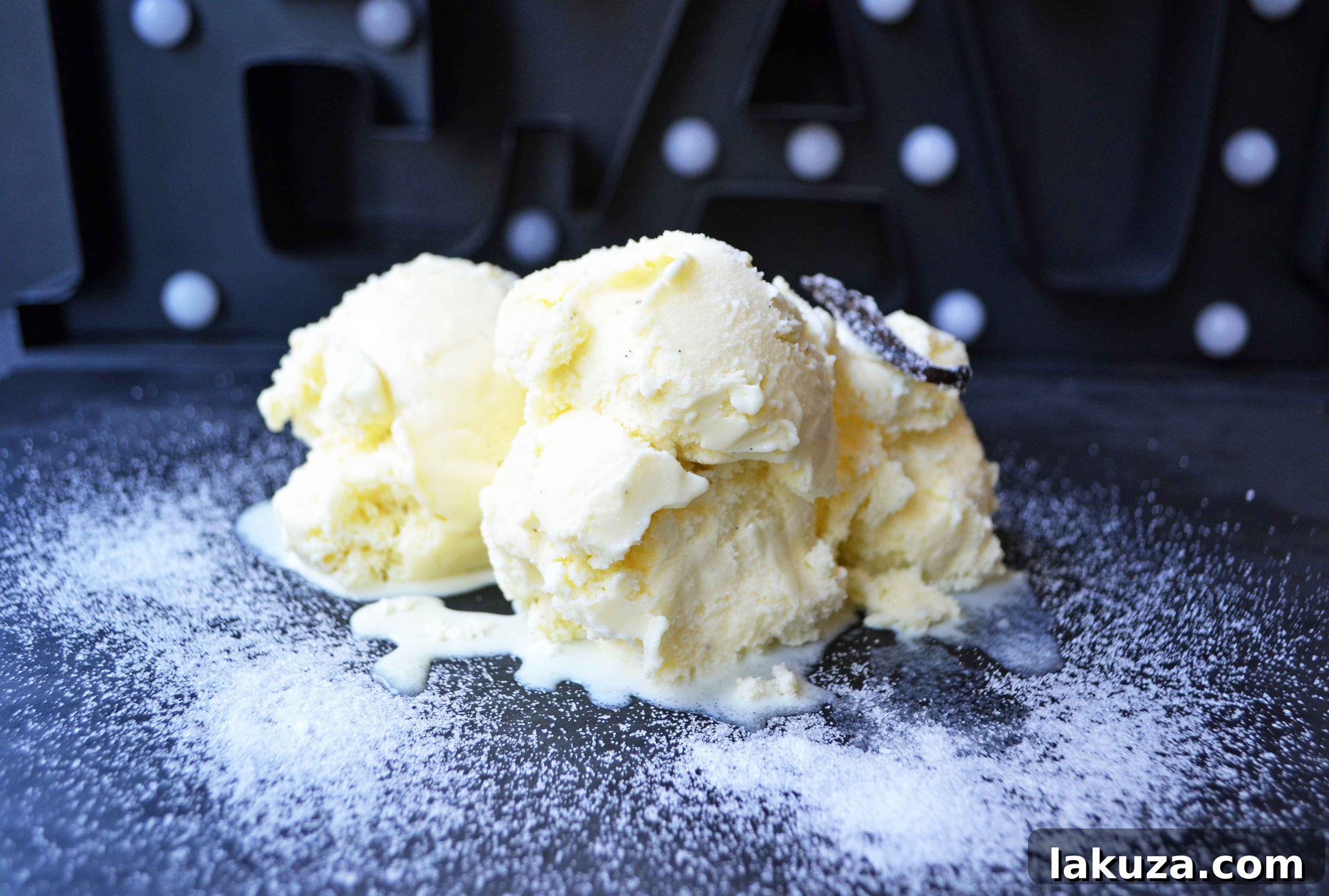 A large bowl of homemade chocolate chip cookie dough ice cream, garnished with extra cookie dough chunks.