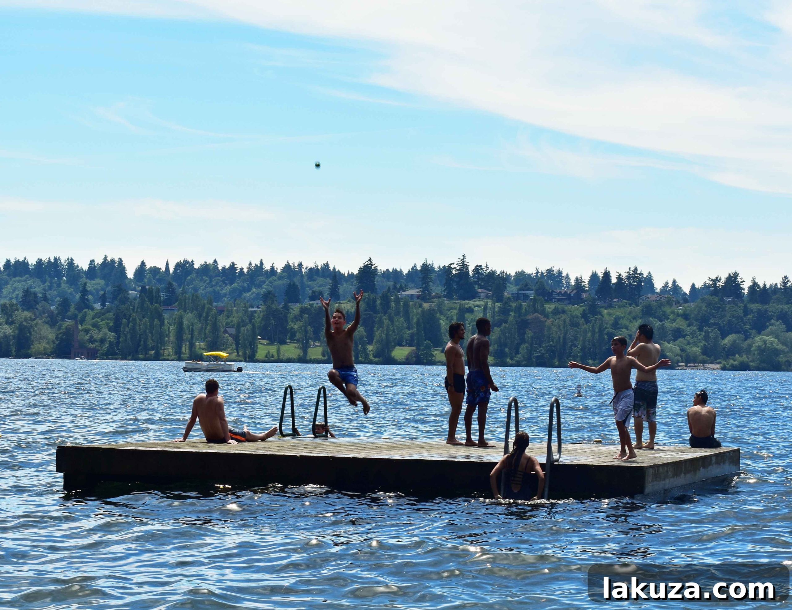 Kids having fun at the jumping platform in Chism Beach Park. An exciting activity for families visiting Seattle.
