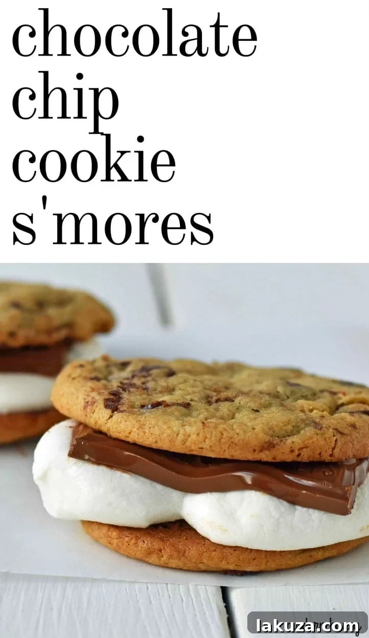 Ultimate S'mores Chocolate Chip Cookies 7 A stack of Chocolate Chip Cookie S'mores, with the top one bitten into, revealing the warm, gooey marshmallow and melted chocolate filling.