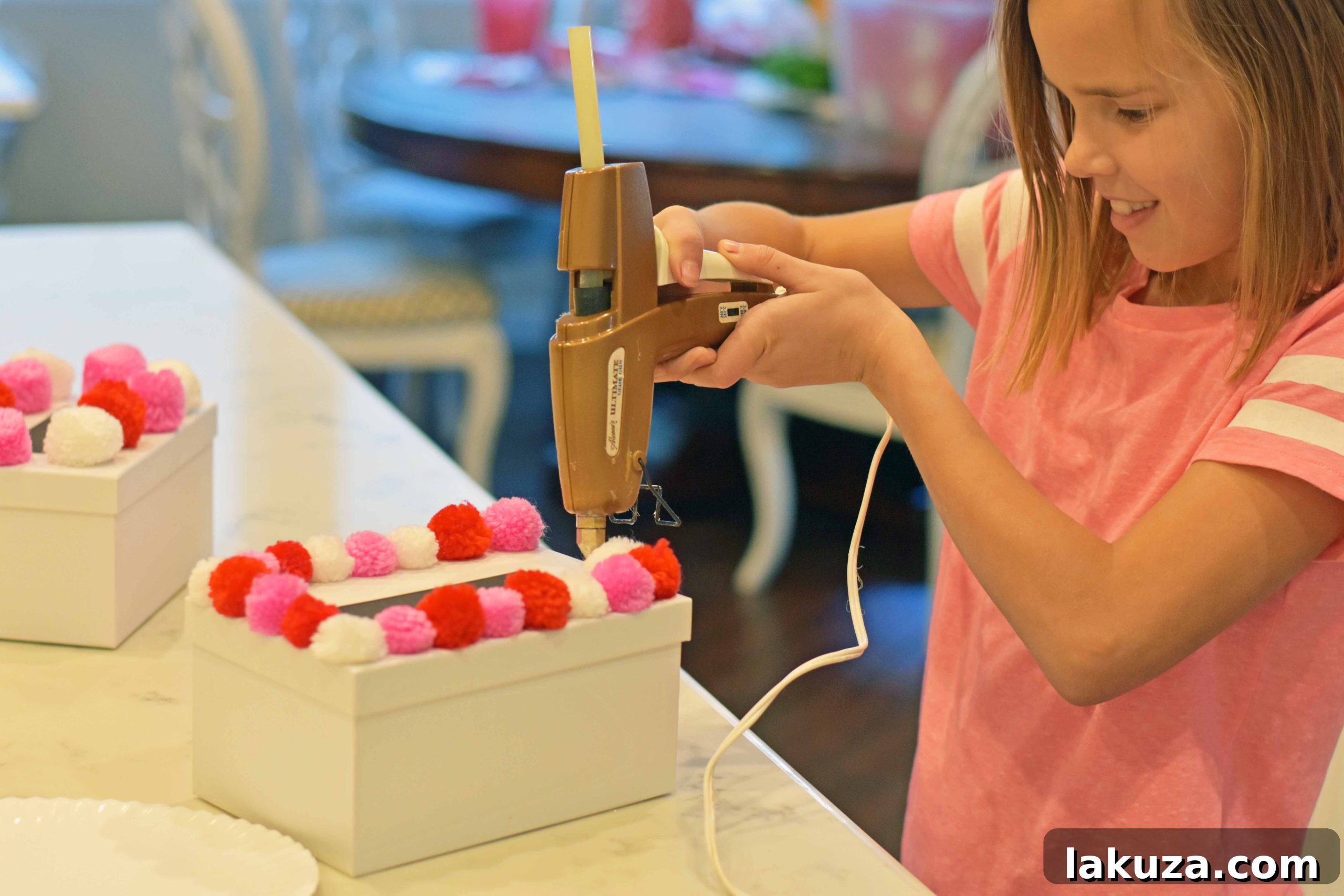 Creating Magical Valentine's Memories with Your Kids 20 How to decorate Valentine's Day boxes with pom poms. Pom Poms Valentine's Day boxes. Easy Valentine's Day boxes for school. Valentine's Day decorating ideas. www.modernhoney.com