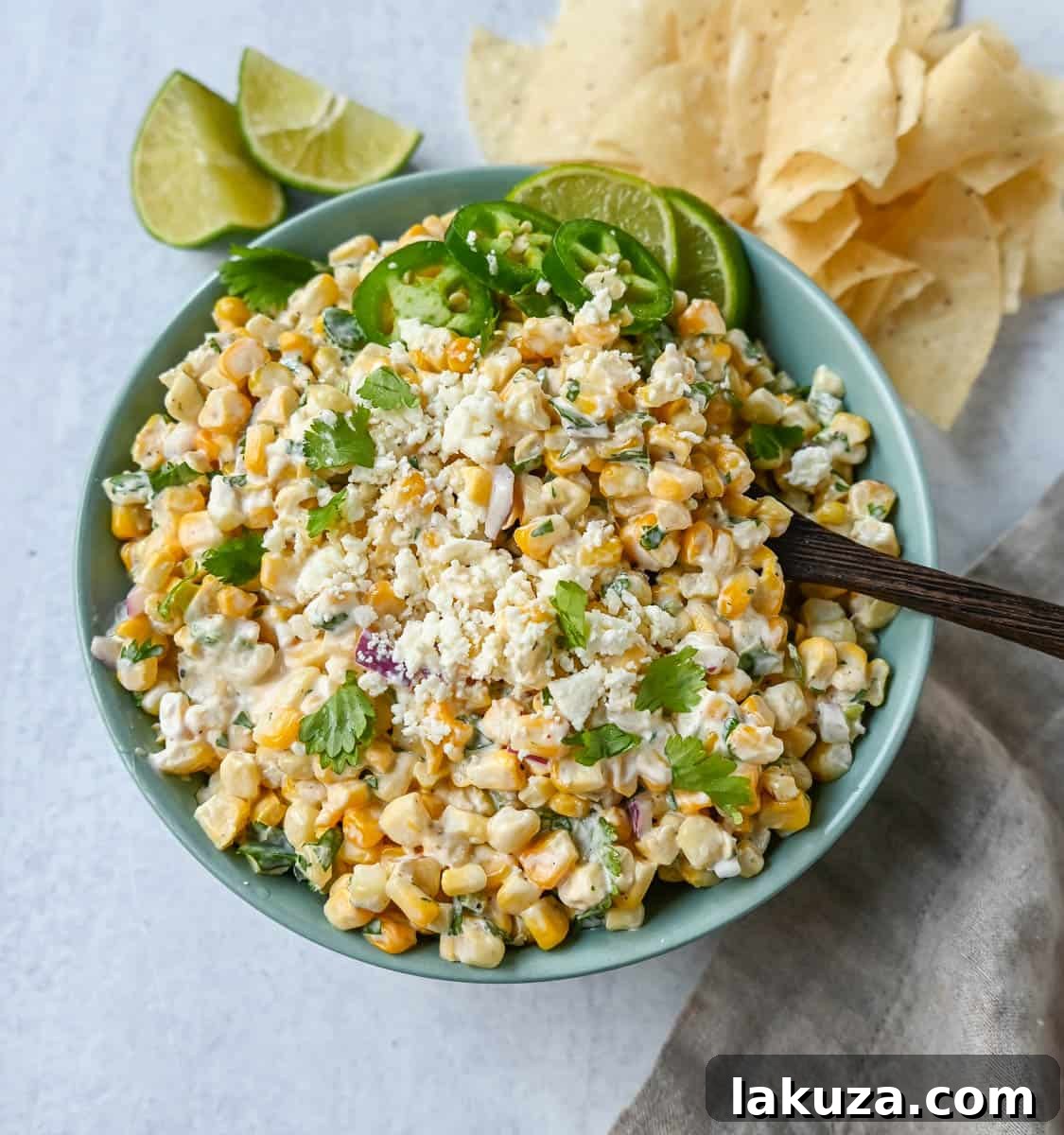 Creamy Elote Dip 2 Creamy and flavorful Mexican Street Corn Dip, a vibrant corn salad made with roasted sweet corn, red onion, cilantro, jalapeño, lime juice, Mexican spices, mayonnaise, and cotija cheese.