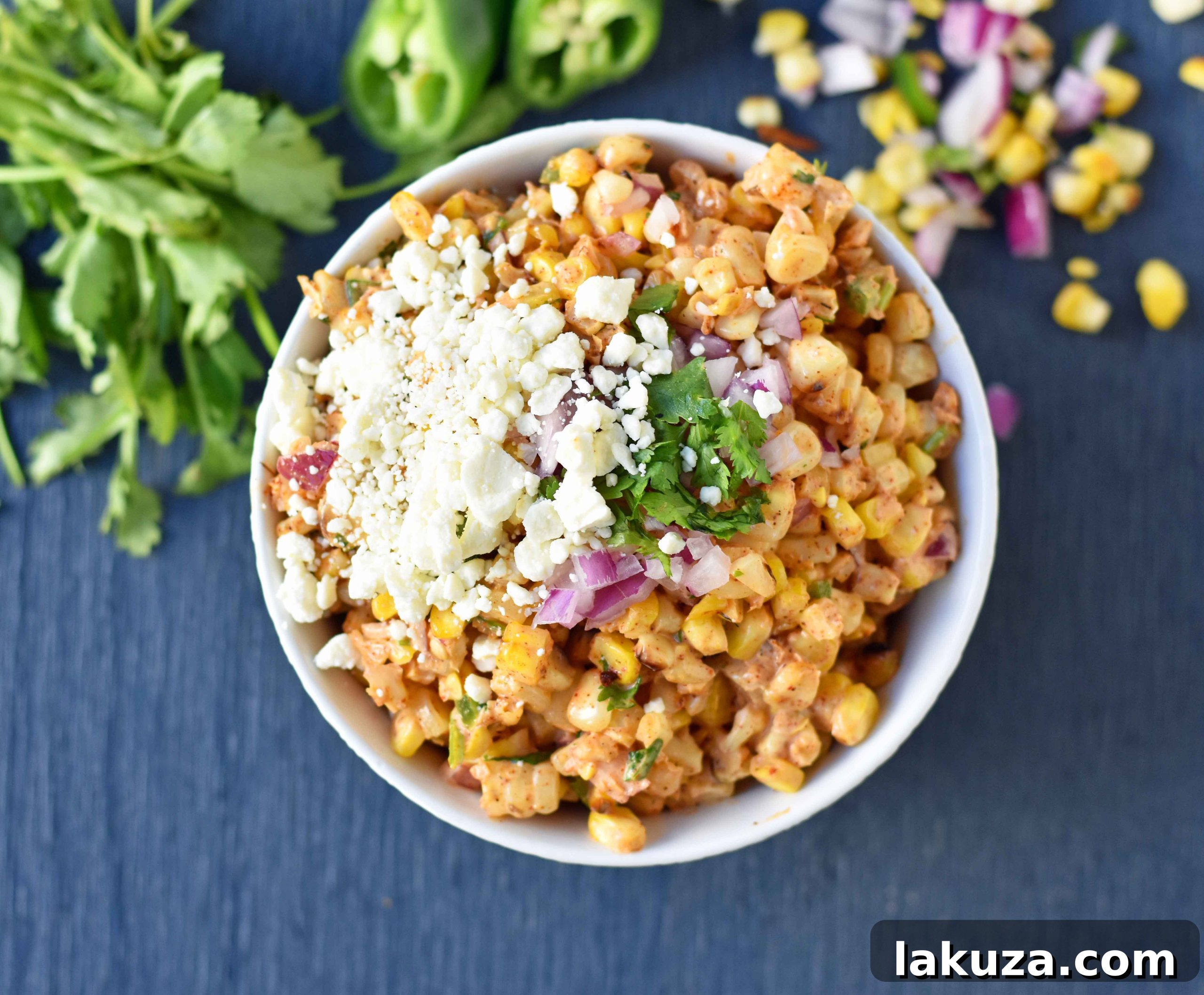 Creamy Elote Dip 5 A vibrant bowl of Mexican Street Corn Salad, featuring roasted corn, authentic Mexican spices, fresh lime, cilantro, a creamy mayo-based dressing, and cotija cheese. Perfect as a Mexican side dish, appetizer, or taco topping.