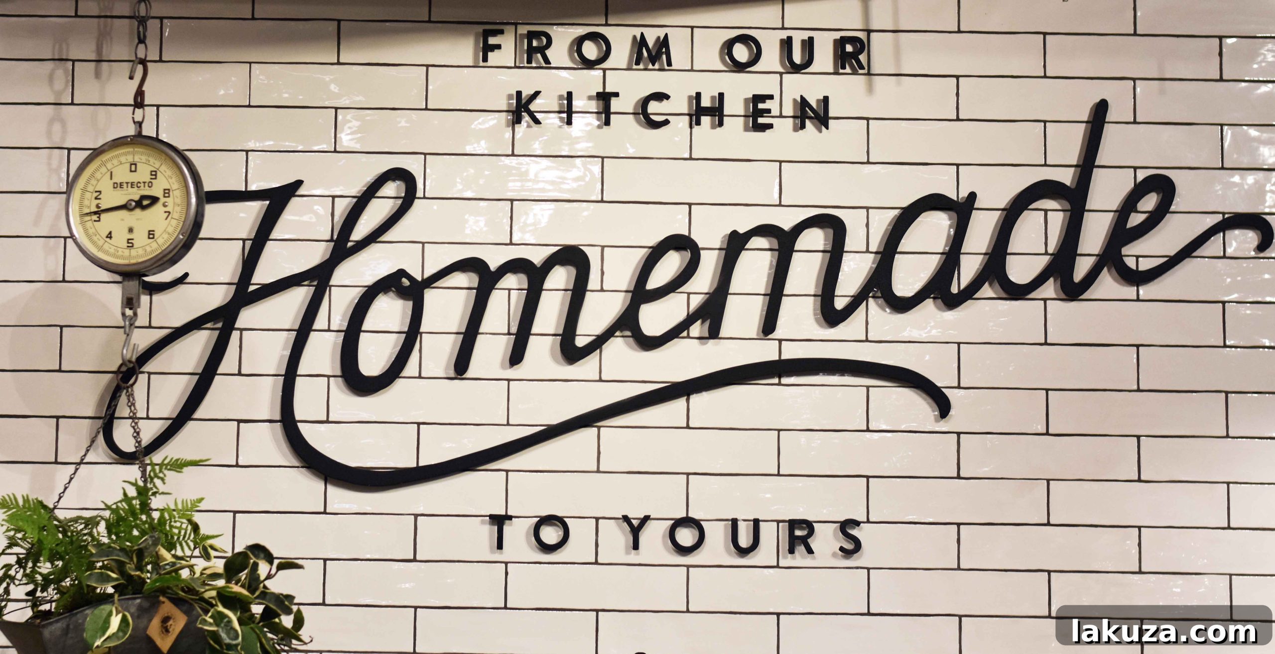 A collection of Magnolia brand cookbooks and home goods, reflecting the market's curated offerings
