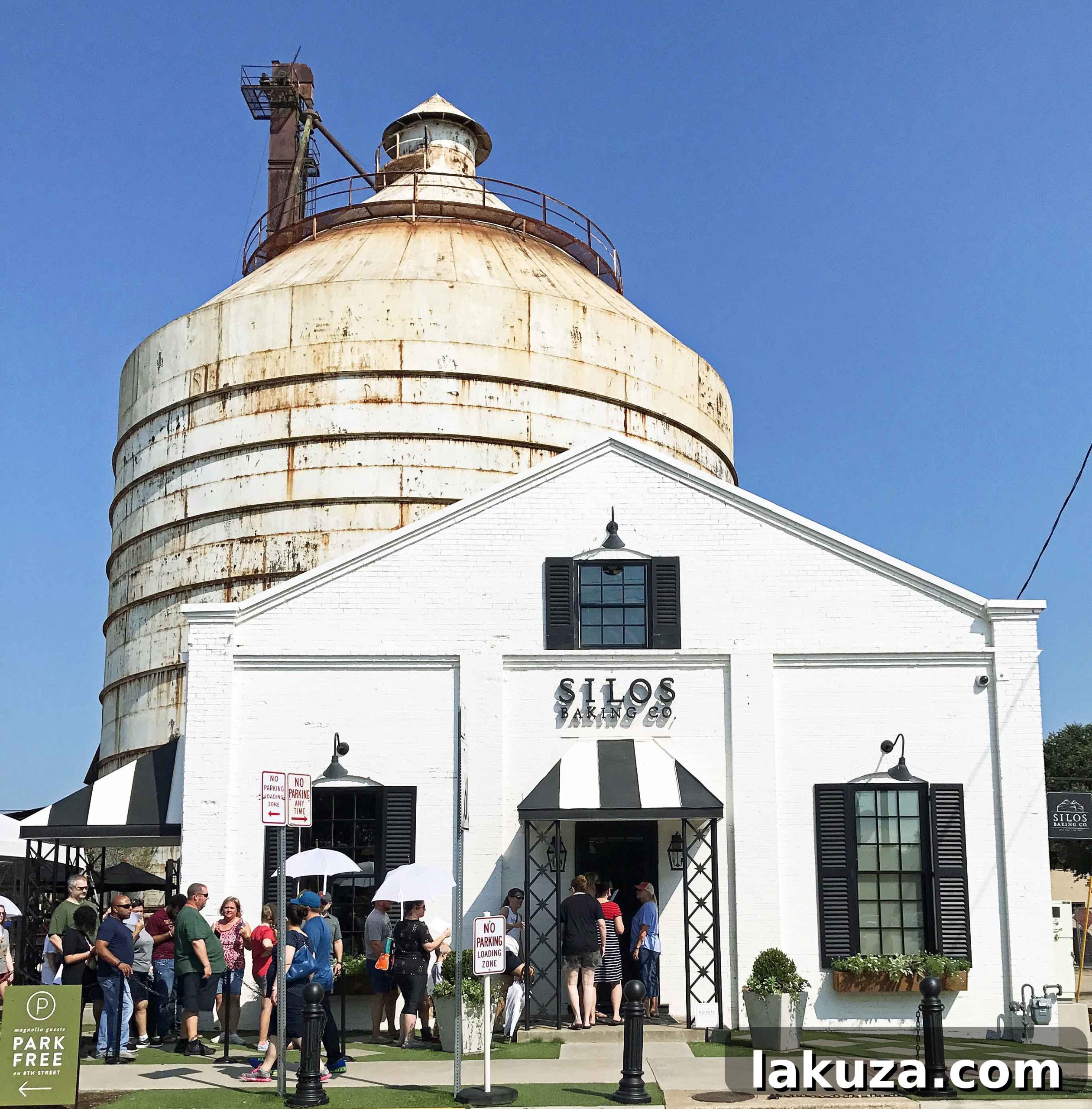 The charming exterior of Silo Baking Co., a popular stop for sweet treats at Magnolia Market