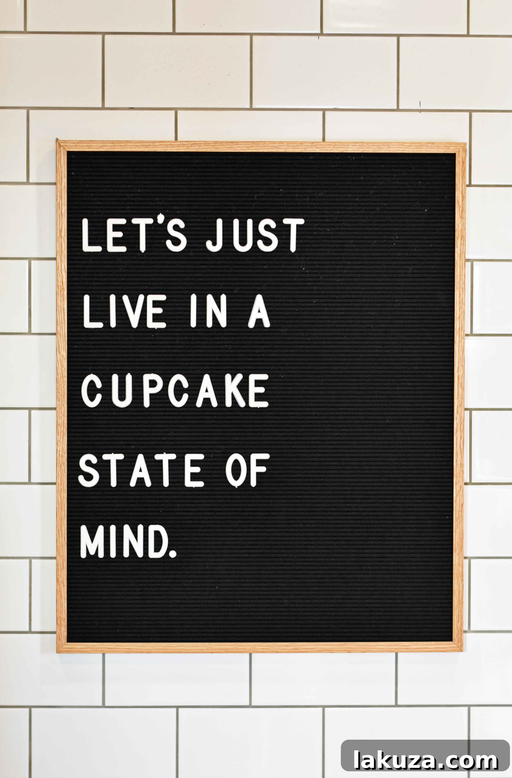 A close-up of a delightful cupcake from Silo Baking Co., adorned with a decorative pick
