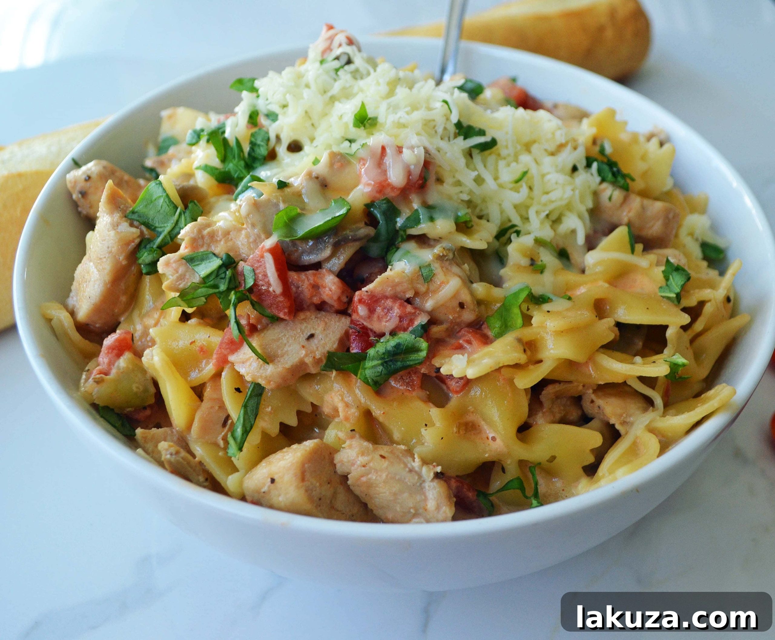 Serving of All Dressed Up Bowtie Chicken Pasta. Highlighting the texture of the bowtie pasta, tender chicken, and creamy sauce.
