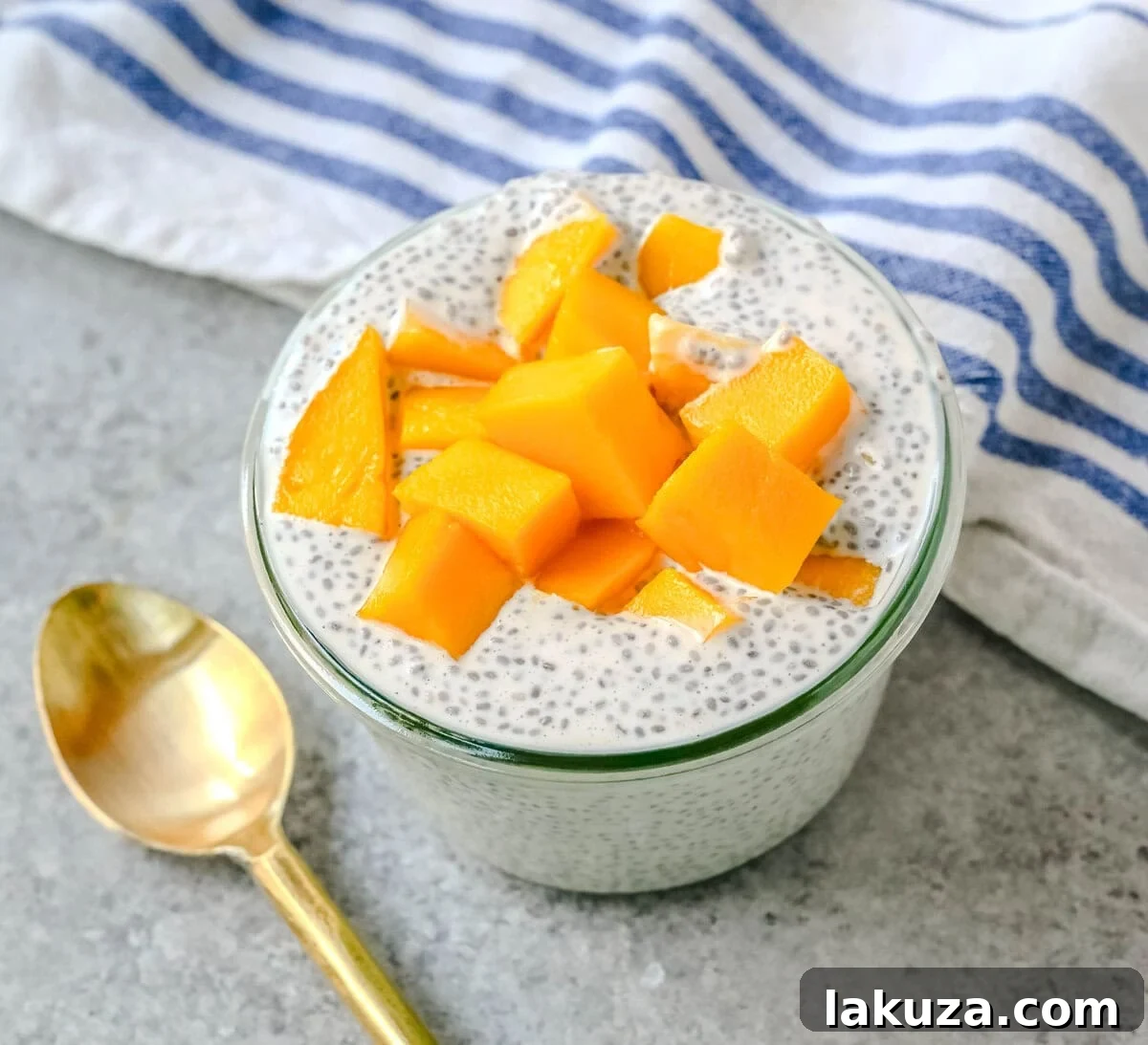 Vibrant Mango Coconut Chia Pudding, a healthy, dairy-free, gluten-free, and refined sugar-free dessert, made with chia seeds, coconut milk, maple syrup, and fresh mango. Perfect for meal prep and clean eating.