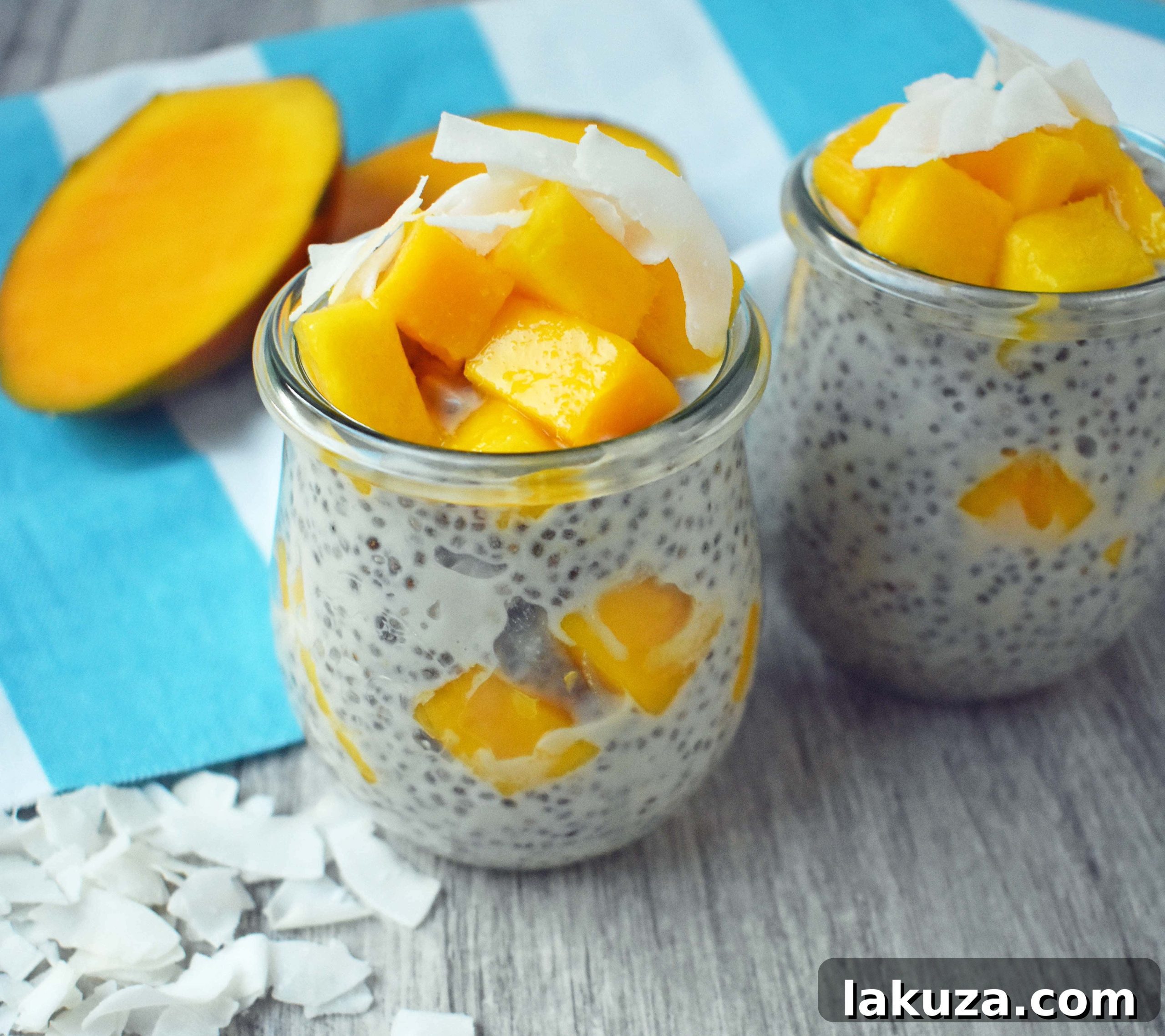 Ingredients for Coconut Mango Chia Pudding laid out: chia seeds, canned coconut milk, maple syrup, vanilla extract, sea salt, fresh mango, and unsweetened coconut flakes. A healthy, gluten-free, sugar-free, dairy-free dessert.