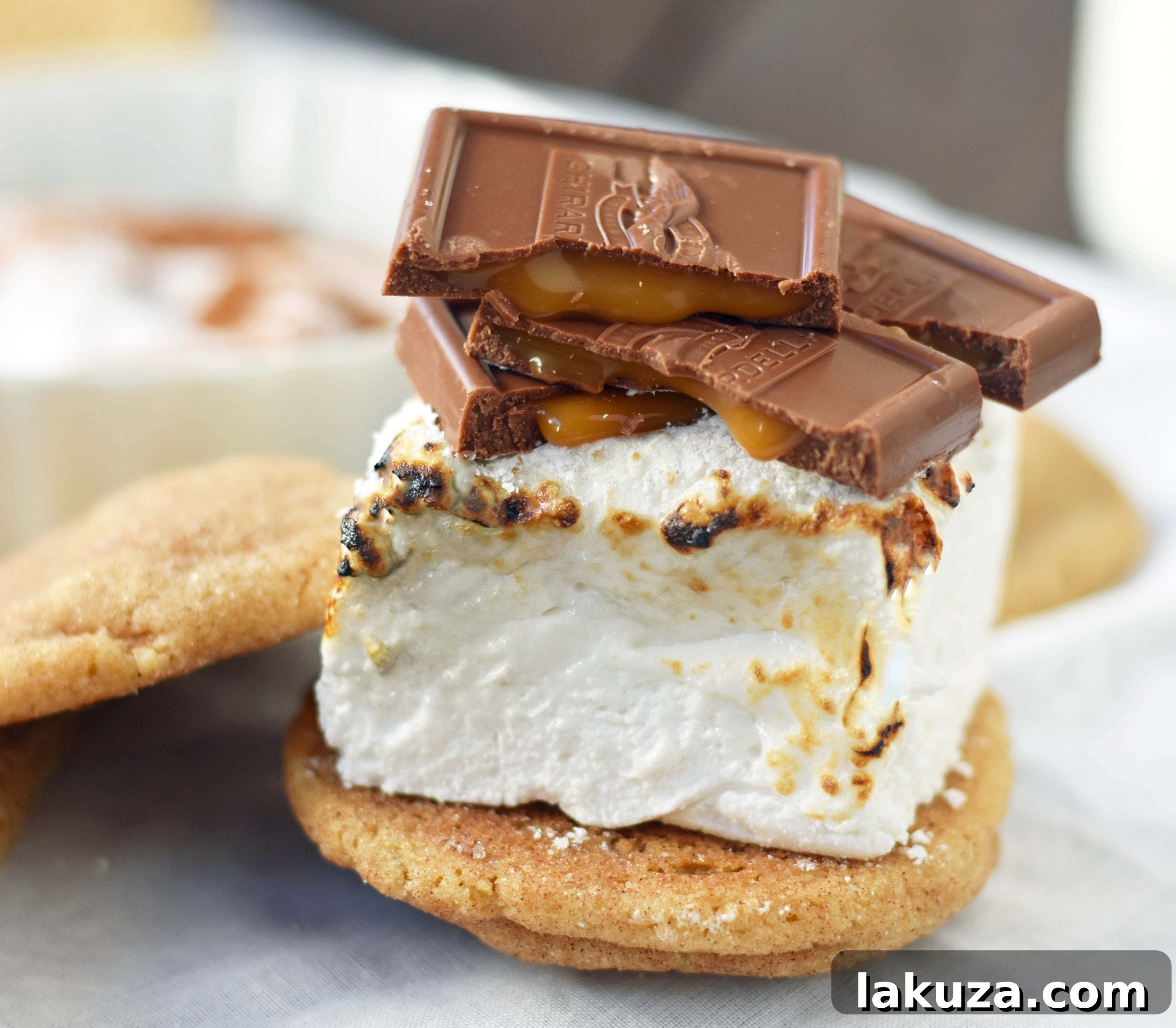 Chocolate Sea Salt Caramel S'mores. Brown Butter Cinnamon Sugar Snickerdoodles layered with homemade marshmallows, sea salt chocolate caramel ghirardelli squares. The perfect gourmet s'more.